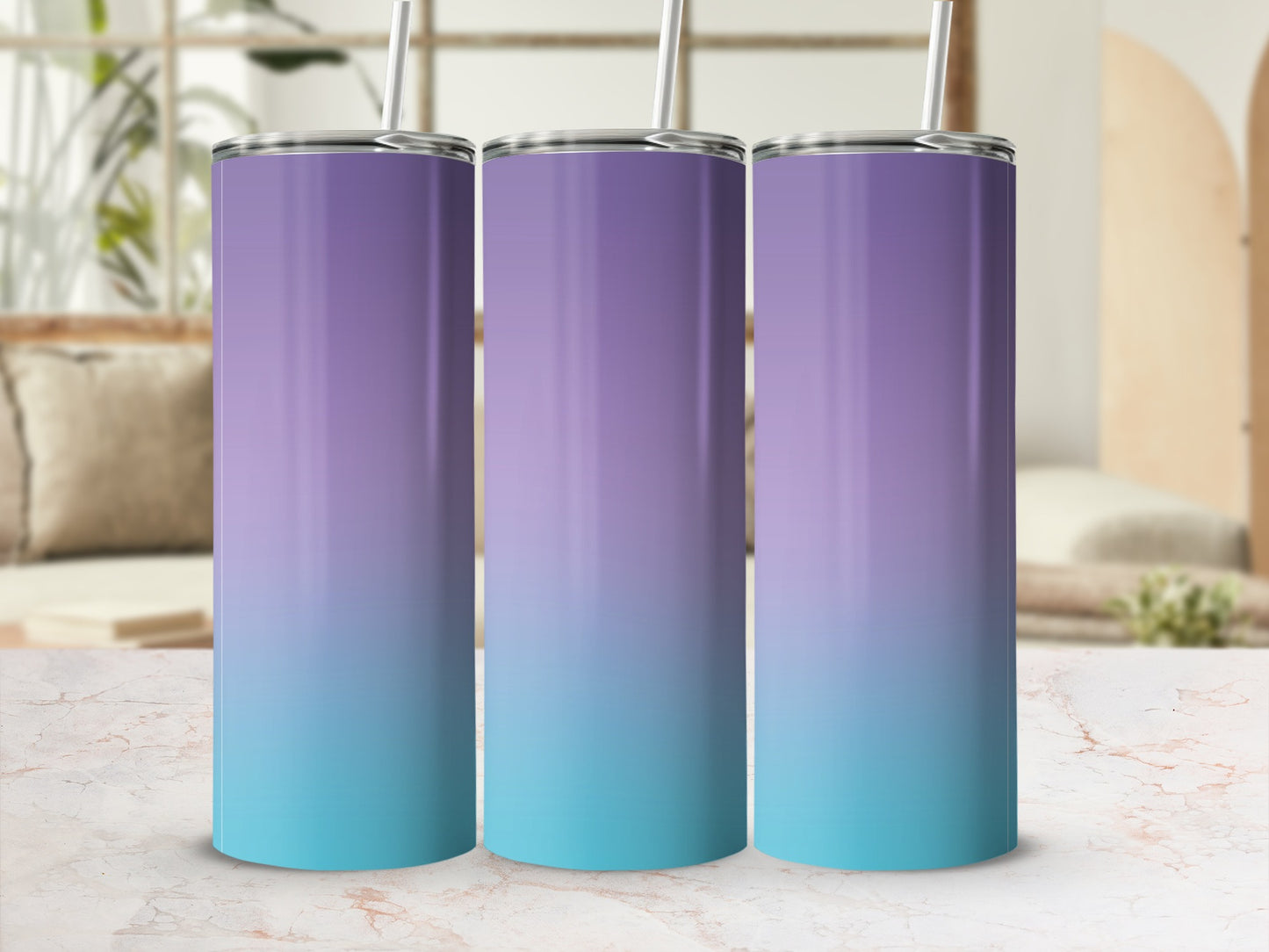 Three gradient tumblers, purple to teal, with straws, on a marble surface.