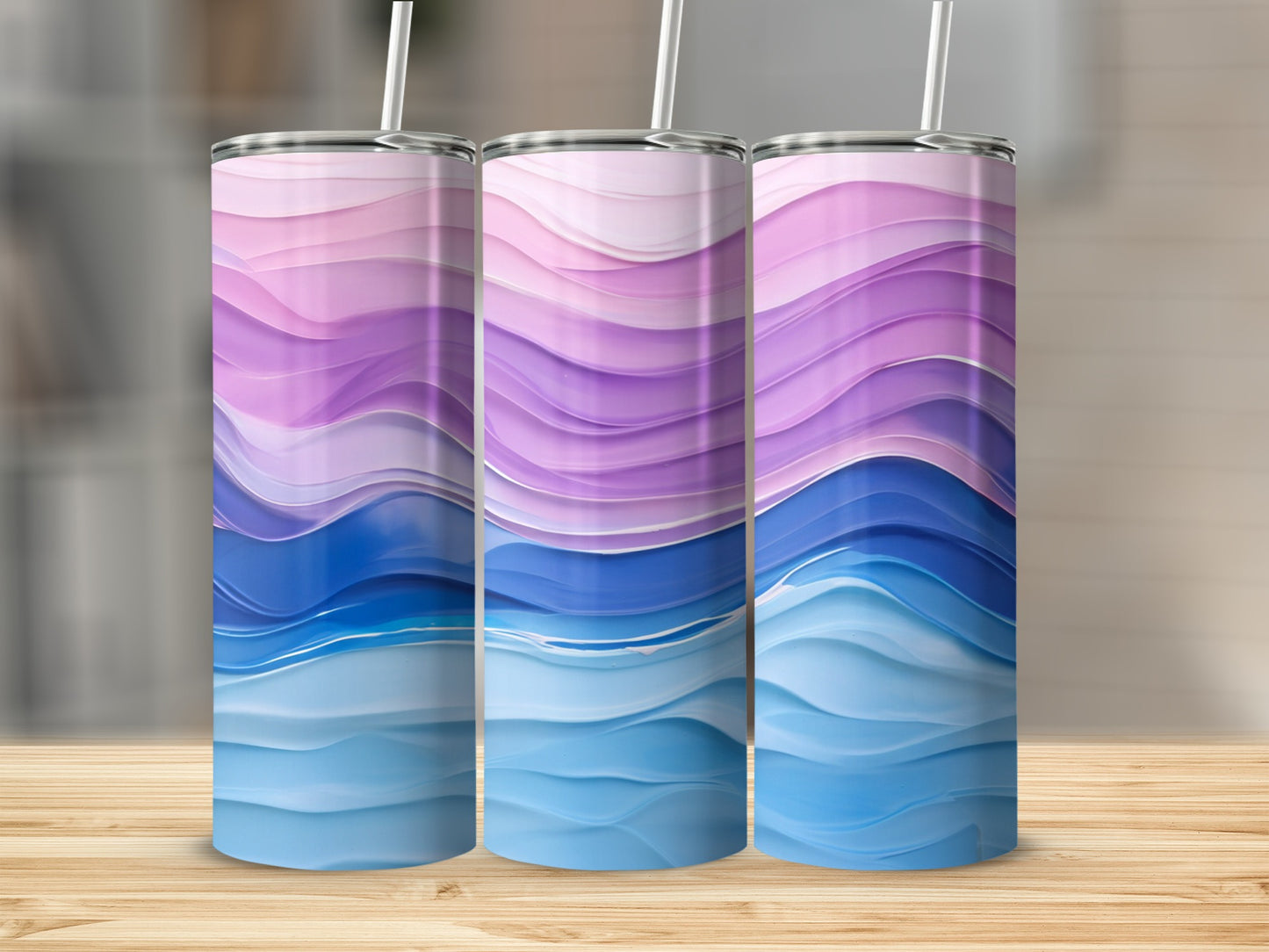 Three tumblers with wavy patterns of purple, pink, and blue on a wooden surface.