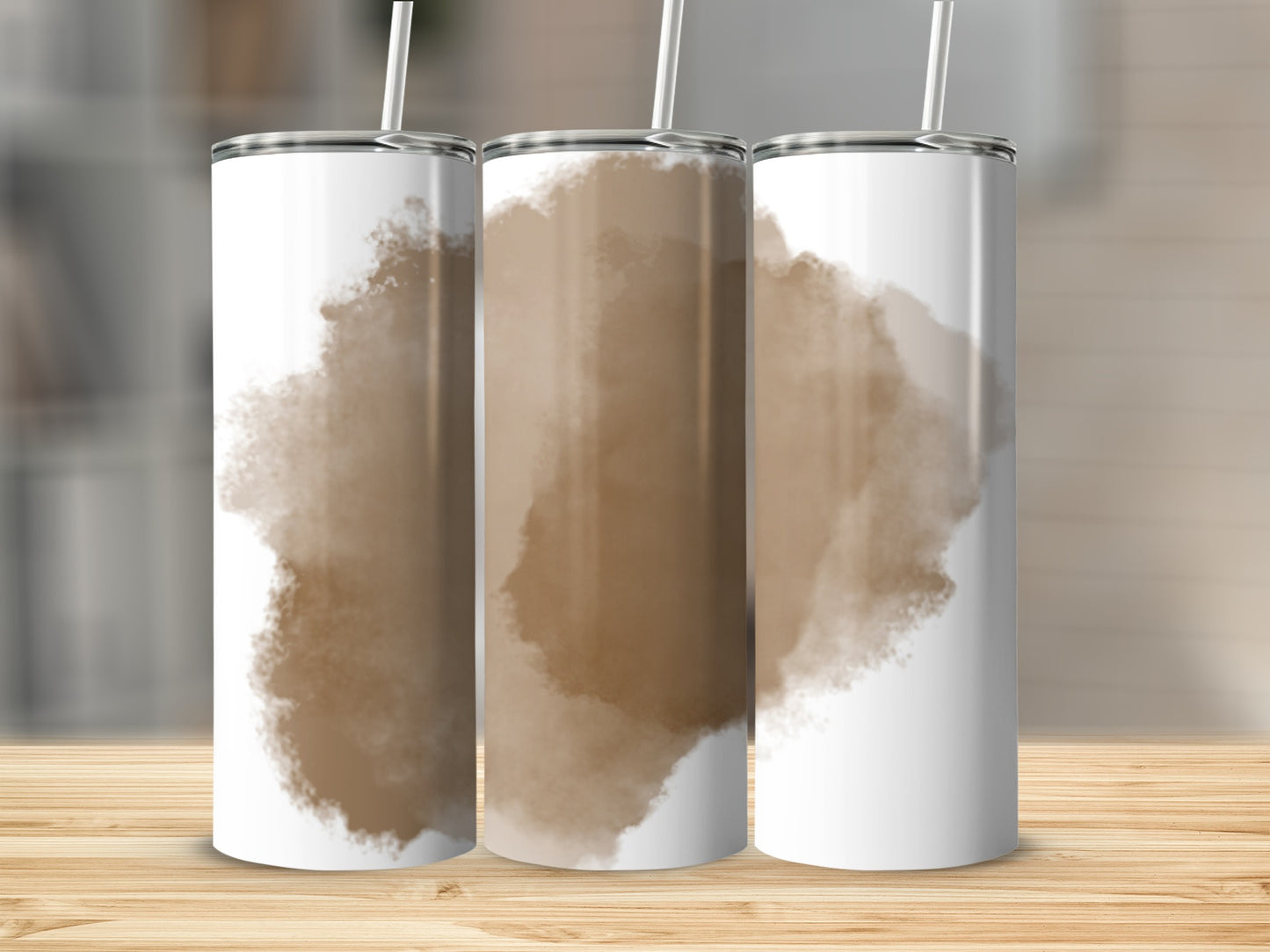Three white tumblers with brown watercolor splotches, standing on a wooden surface.