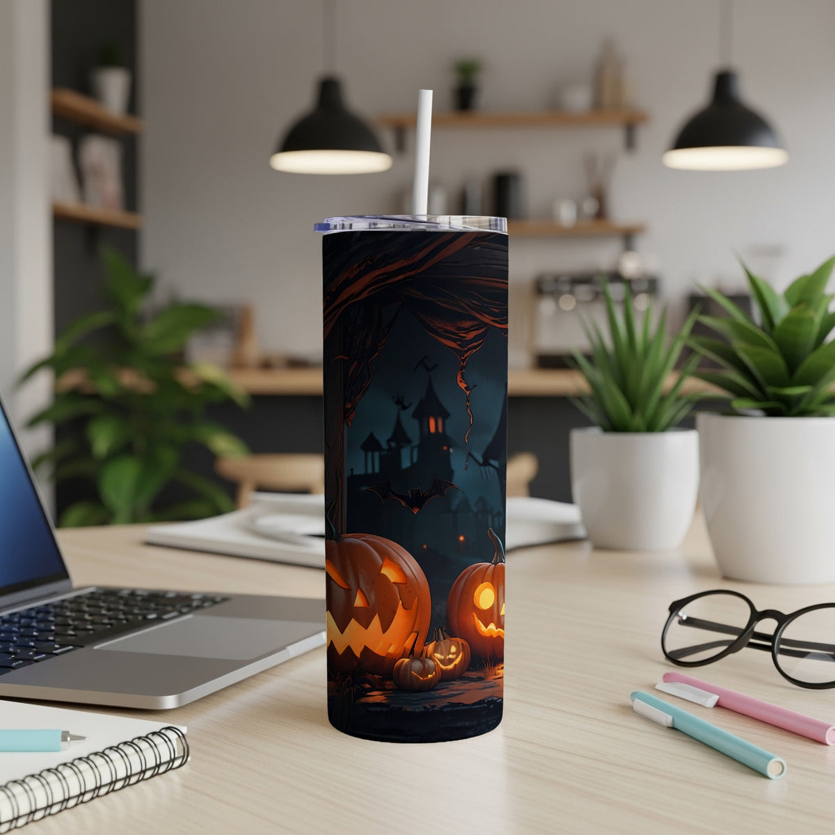 Tumbler with Halloween theme: jack-o'-lanterns, haunted house, bats, and dark forest.