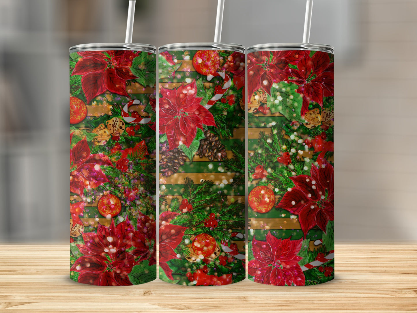 Three tumblers with a festive red poinsettia and pinecone Christmas design.
