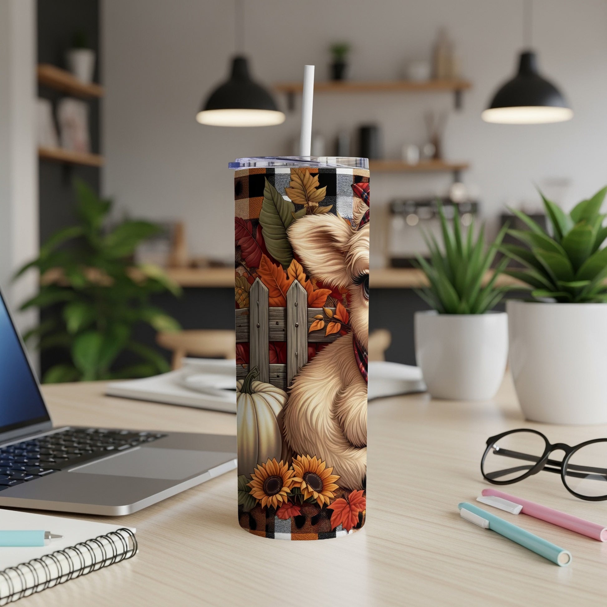 Furry dog with fall leaves and pumpkin on a checkered tumbler.