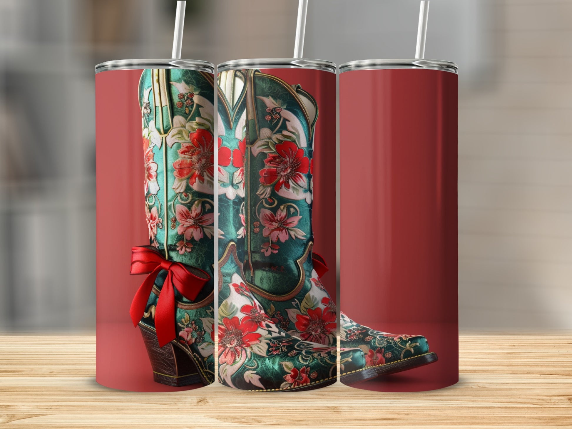 Cowboy boot tumbler with red floral pattern and red bow.