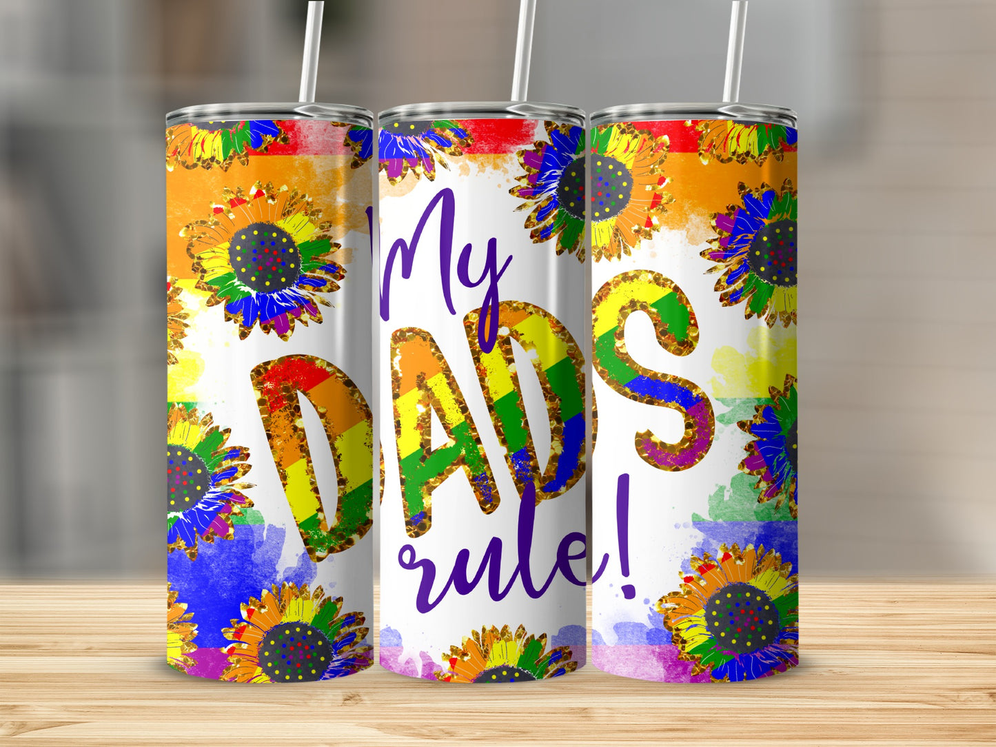 Rainbow gradient sunflowers decorate a tumbler with "My Dads rule!" text.