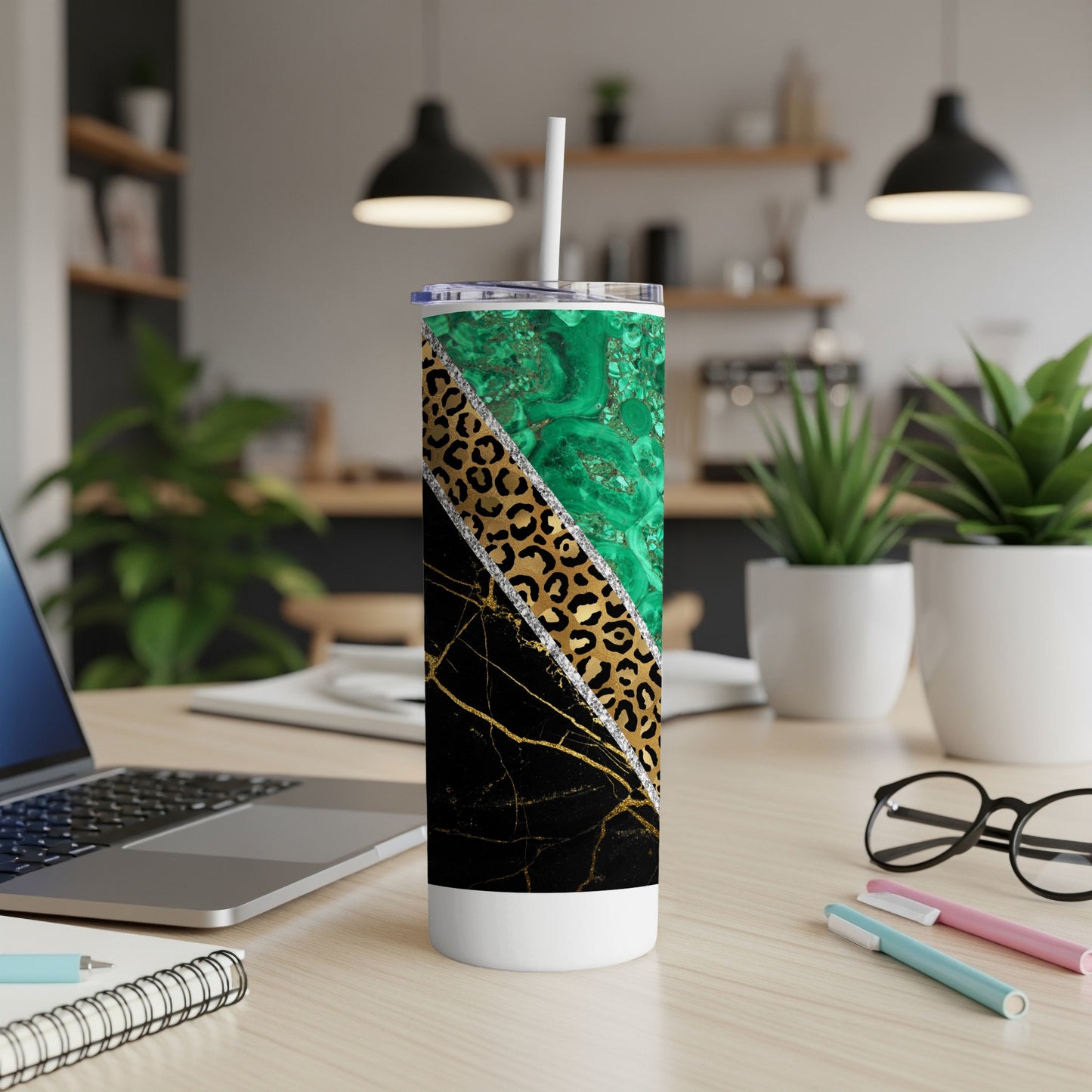 Tall tumbler with green marble, leopard print, and gold glitter designs.