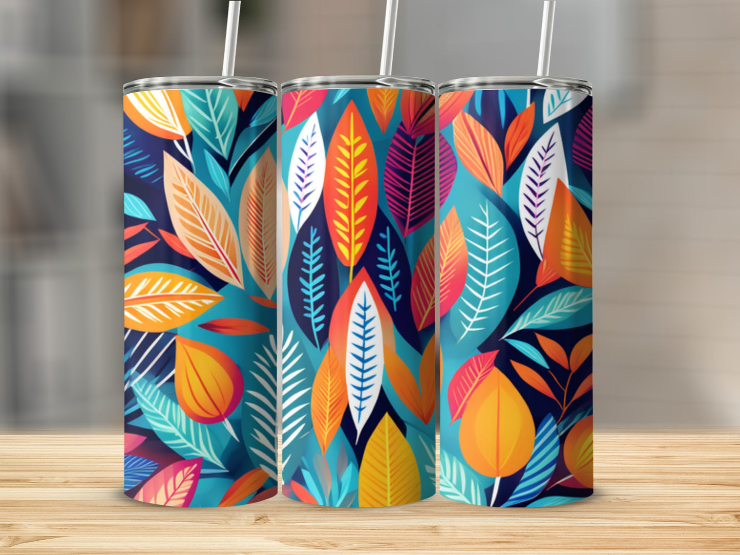 Three tumblers with a colorful abstract leaf pattern.