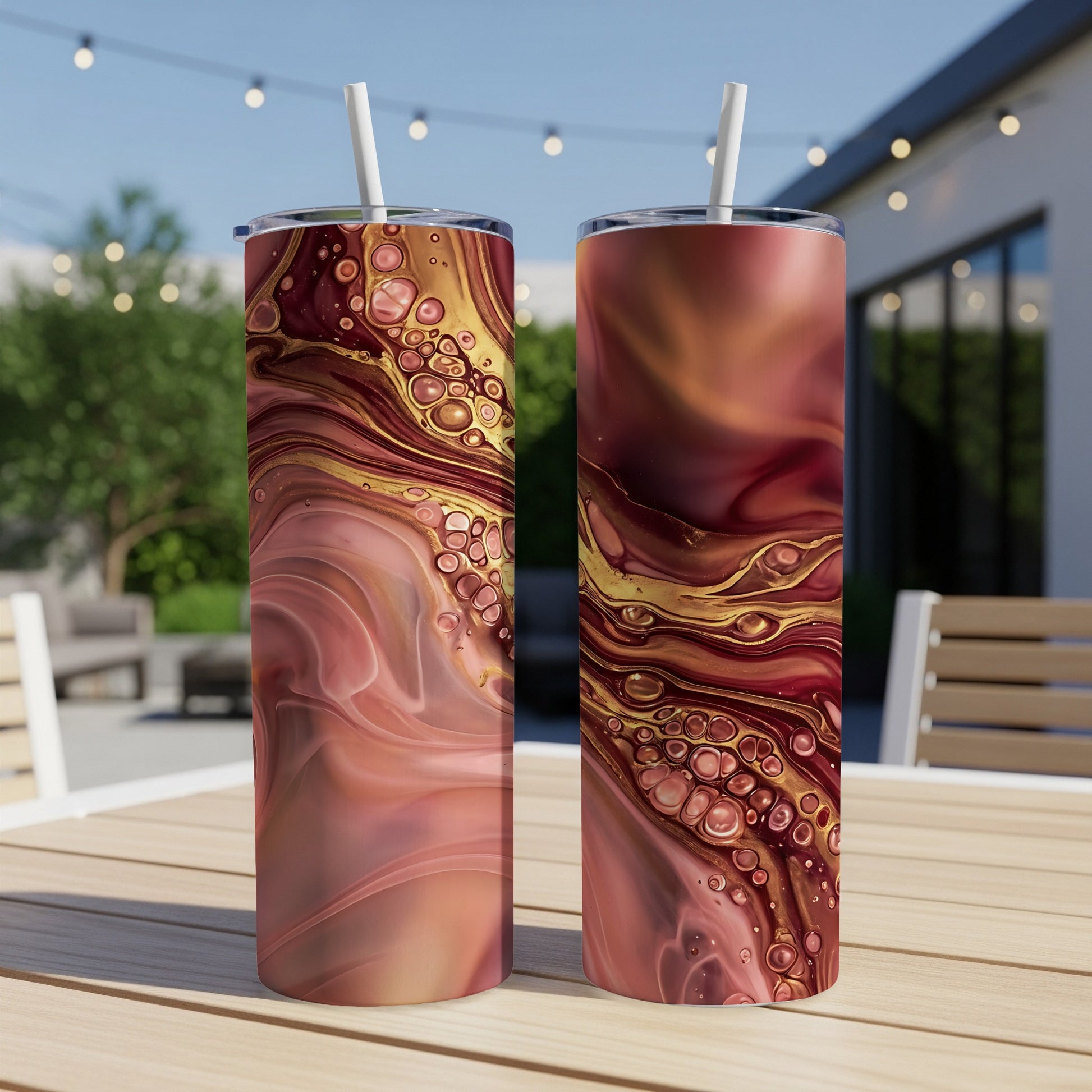 Two tumblers with a marbled fluid art design featuring red, gold, and pink.