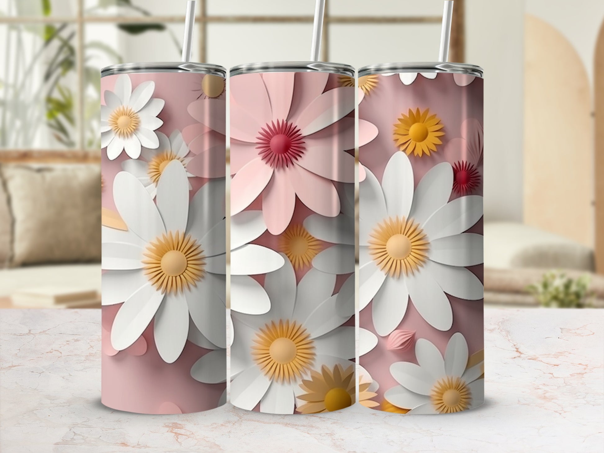 Pink tumbler with repeating white and yellow daisy floral pattern.