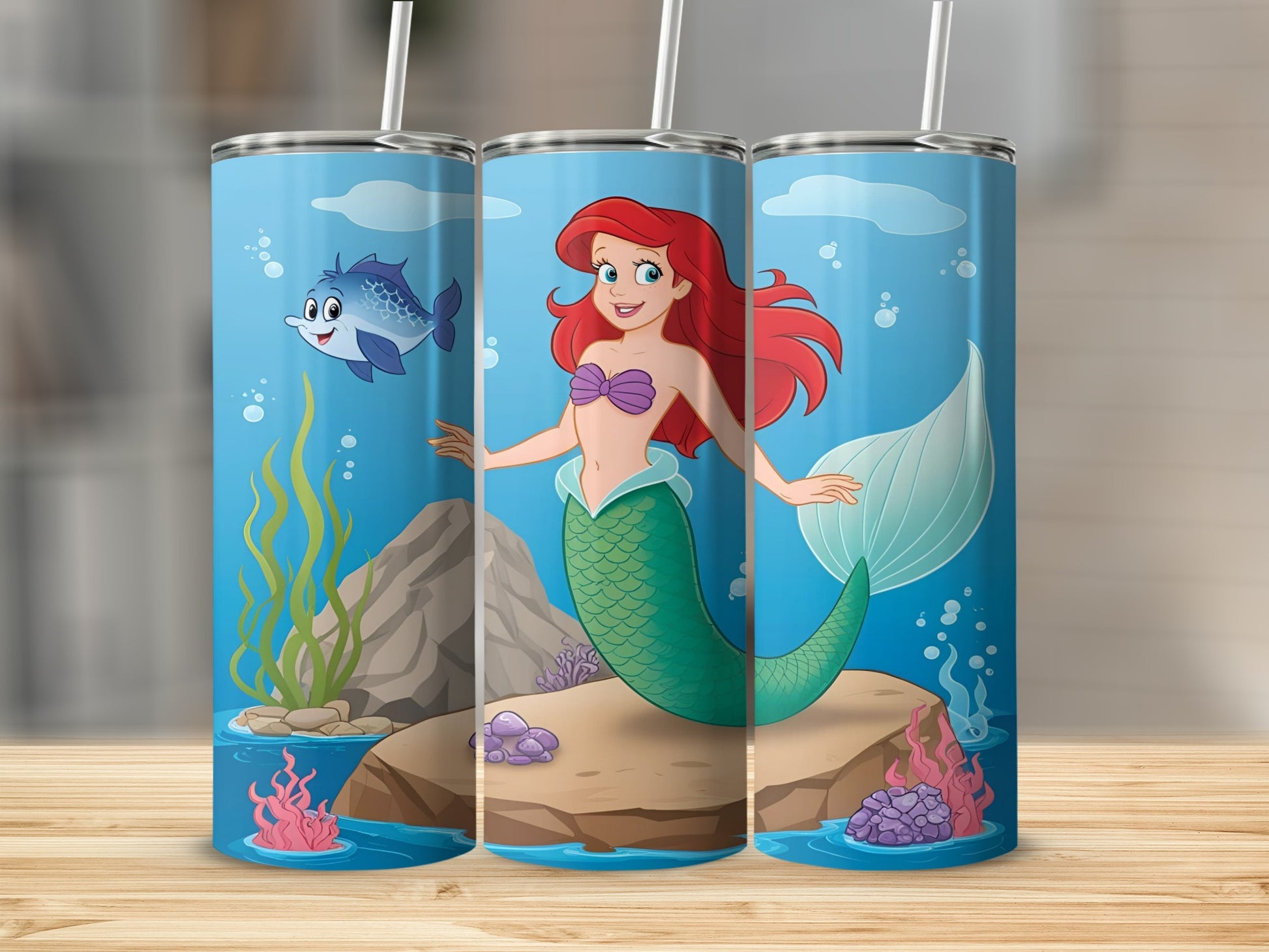 Ariel the Little Mermaid on a rock with a fish and coral.