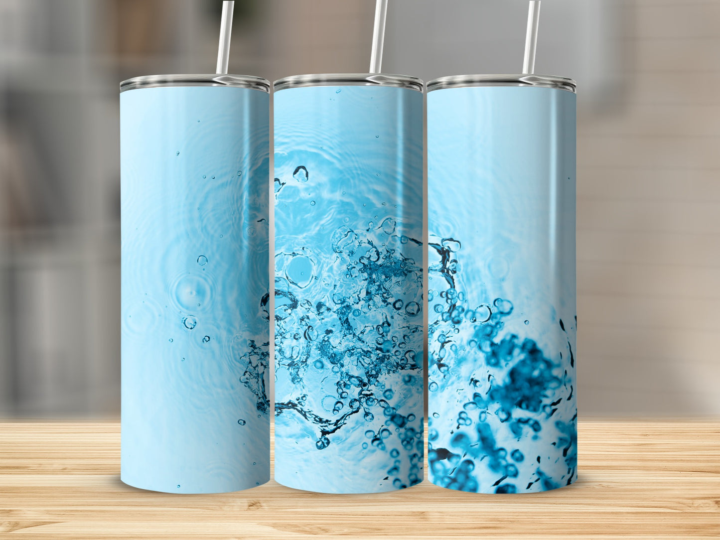 Three tumblers with abstract blue water splash pattern.