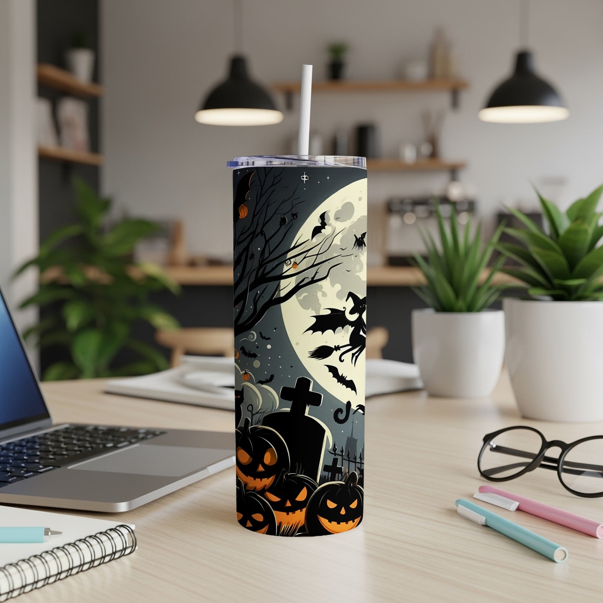 Tumbler with Halloween design featuring pumpkins, witch, bats, and a large moon.