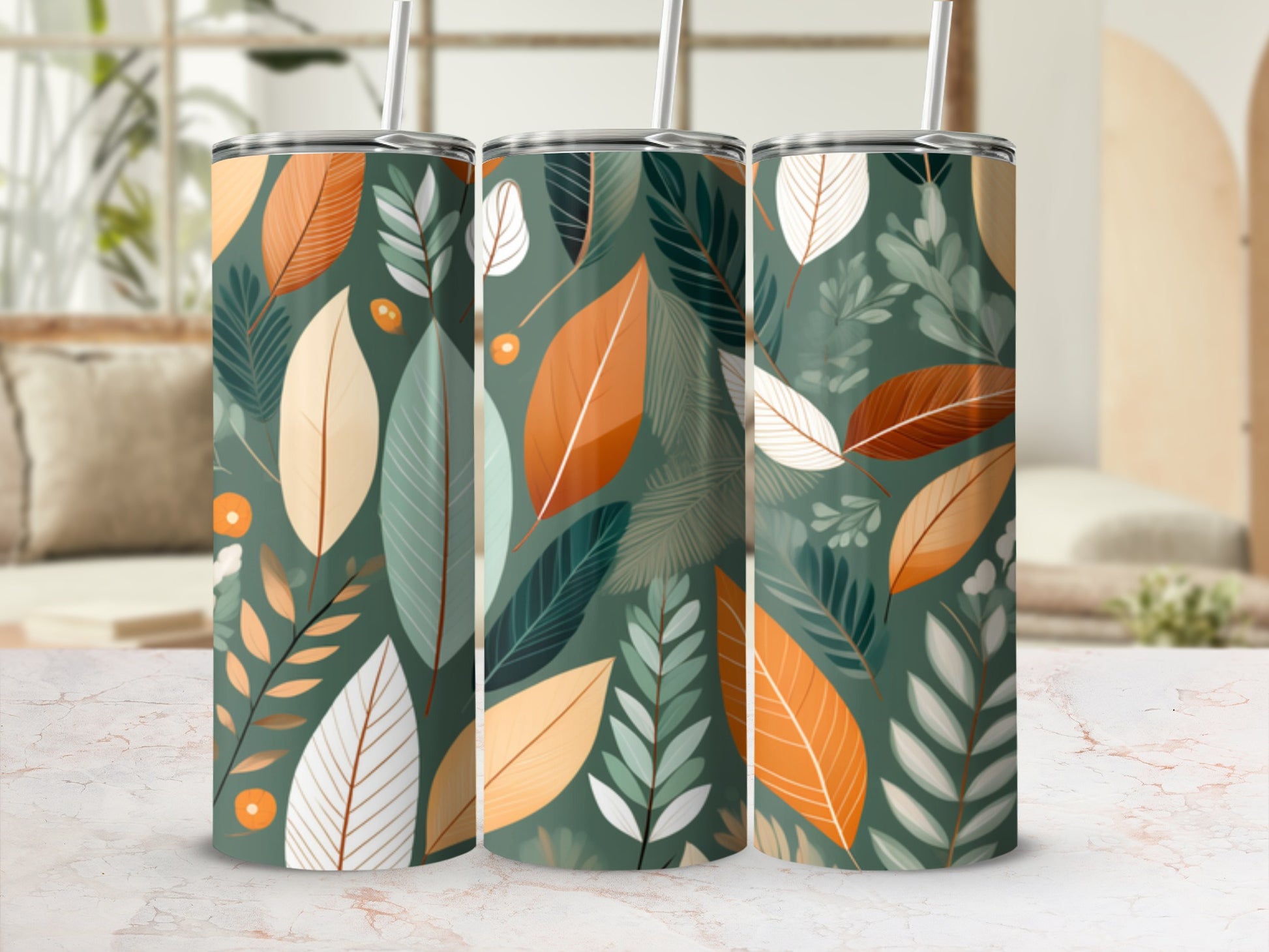 Three tumblers with a repeating pattern of abstract leaves in muted greens, oranges, and creams.