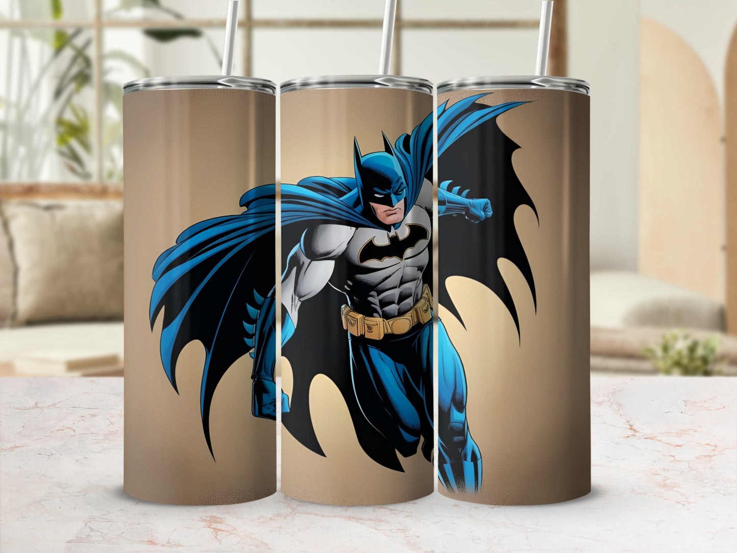 Batman artwork on a tan tumbler with a straw.