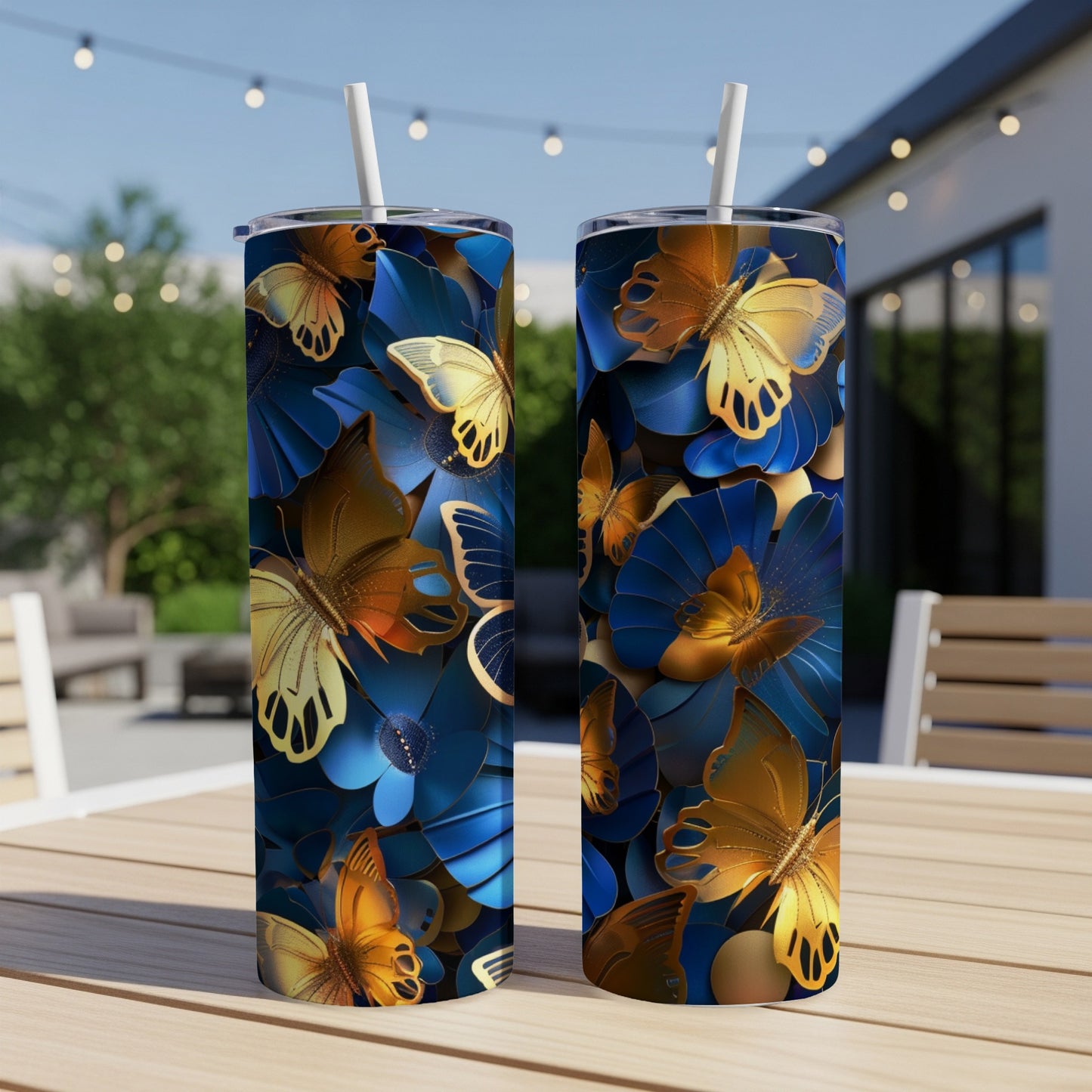 Two tall tumblers with golden butterflies and blue floral pattern.