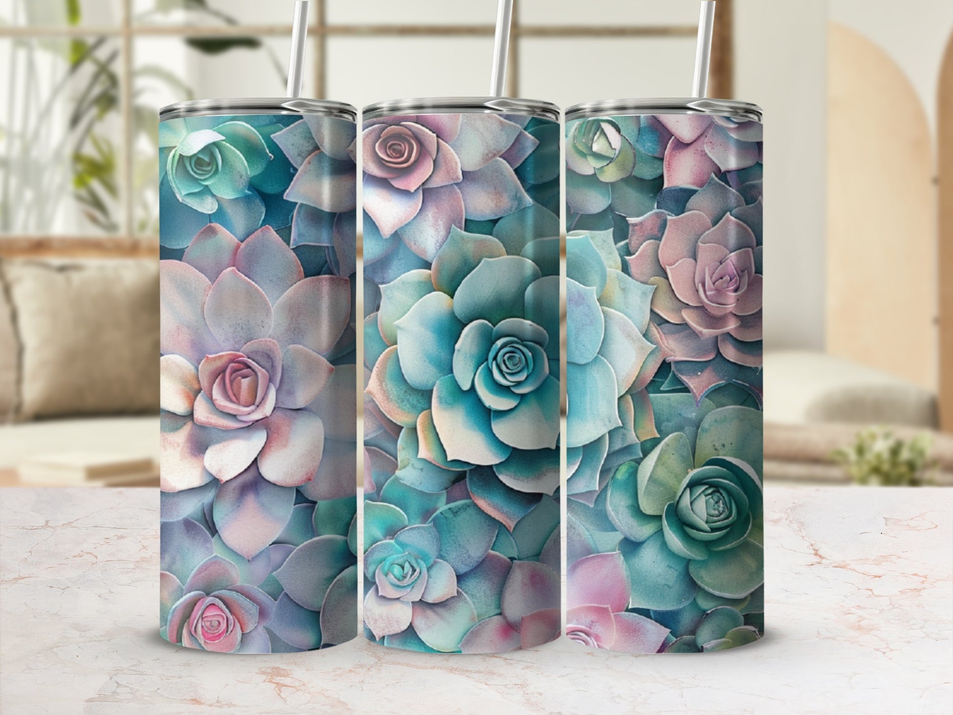 Three tall tumblers with a succulent floral pattern in pastel colors.
