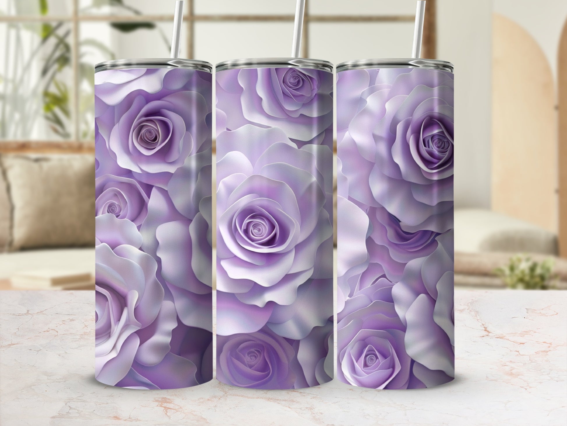 Three purple rose pattern tumblers with straws on a marble countertop.