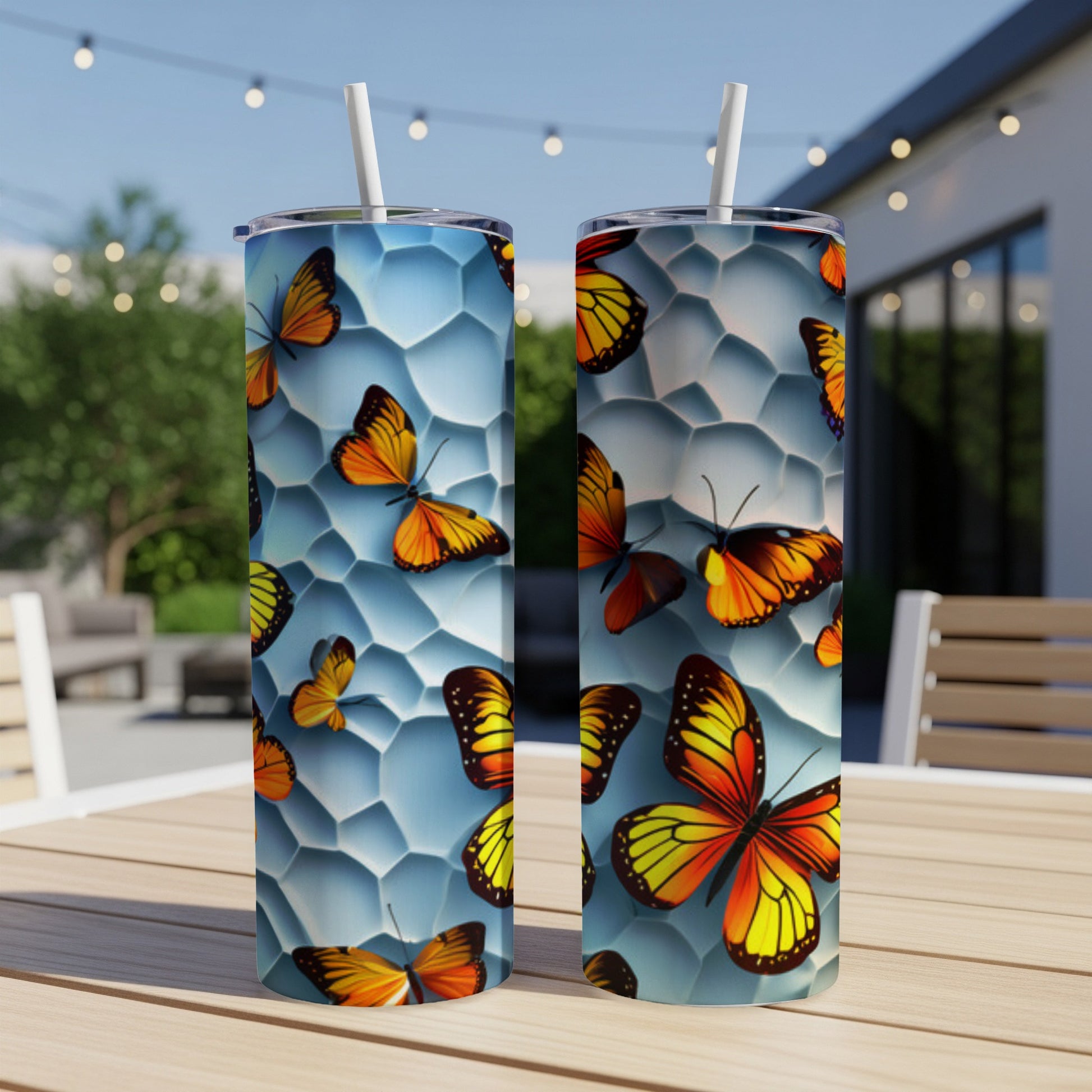 Two tumblers with orange and black butterflies on a honeycomb background.