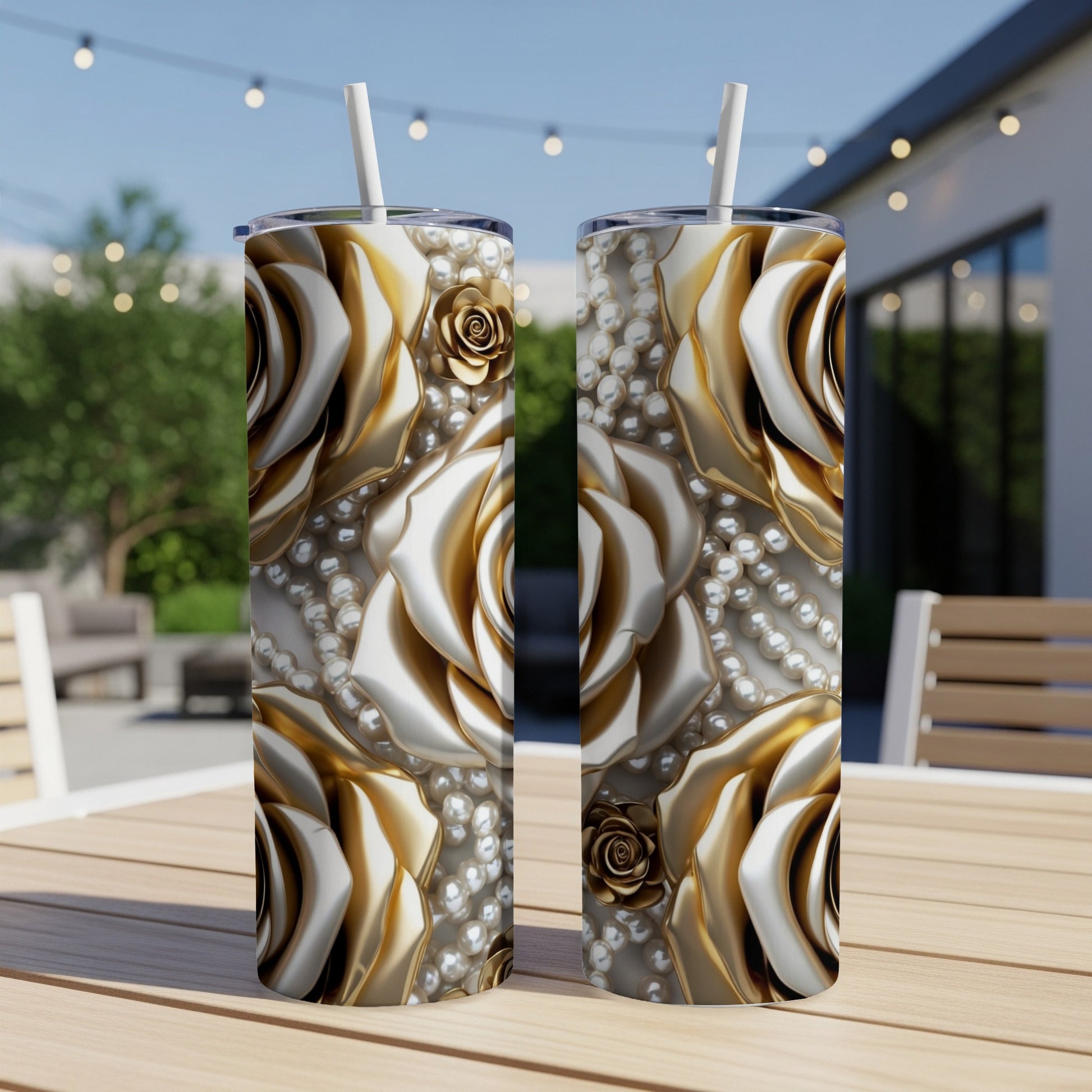 Two tall tumblers with a gold rose and pearl design.