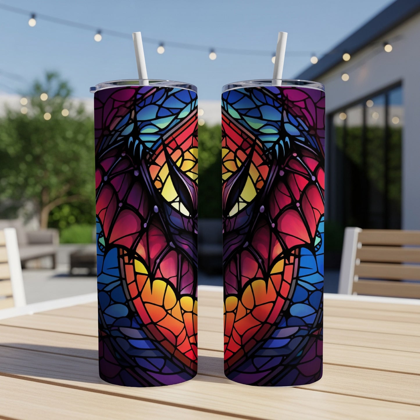 Two stained-glass style dragon wings on tumblers with straws.