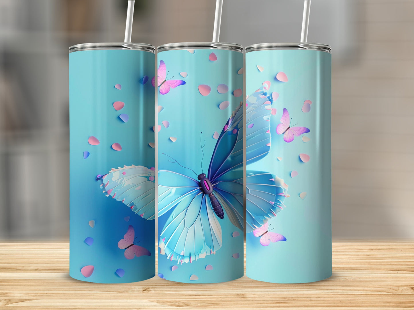 Three teal tumblers with blue butterflies and pink petals.