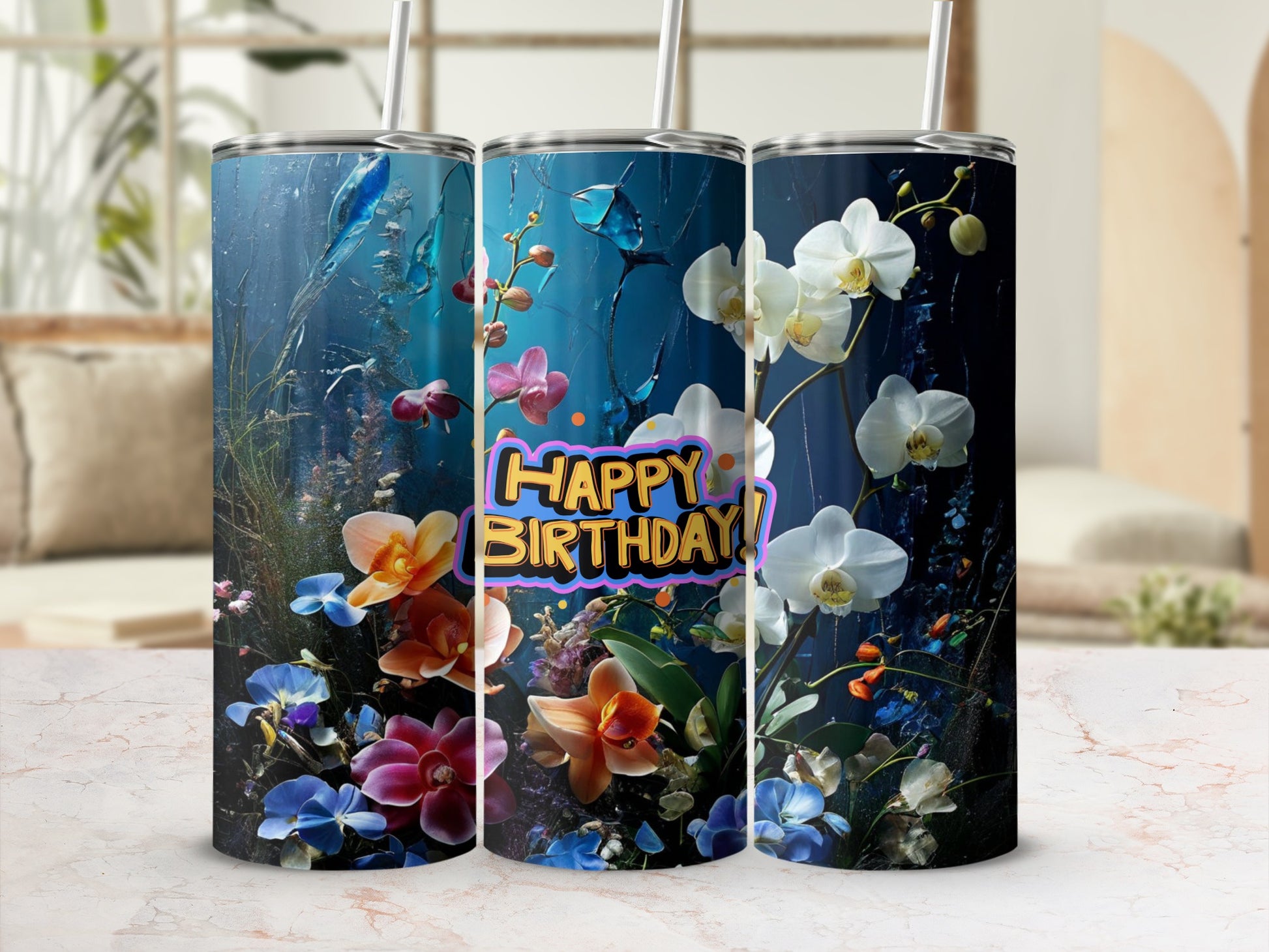 Tumbler with "Happy Birthday" text surrounded by colorful flowers and underwater elements.