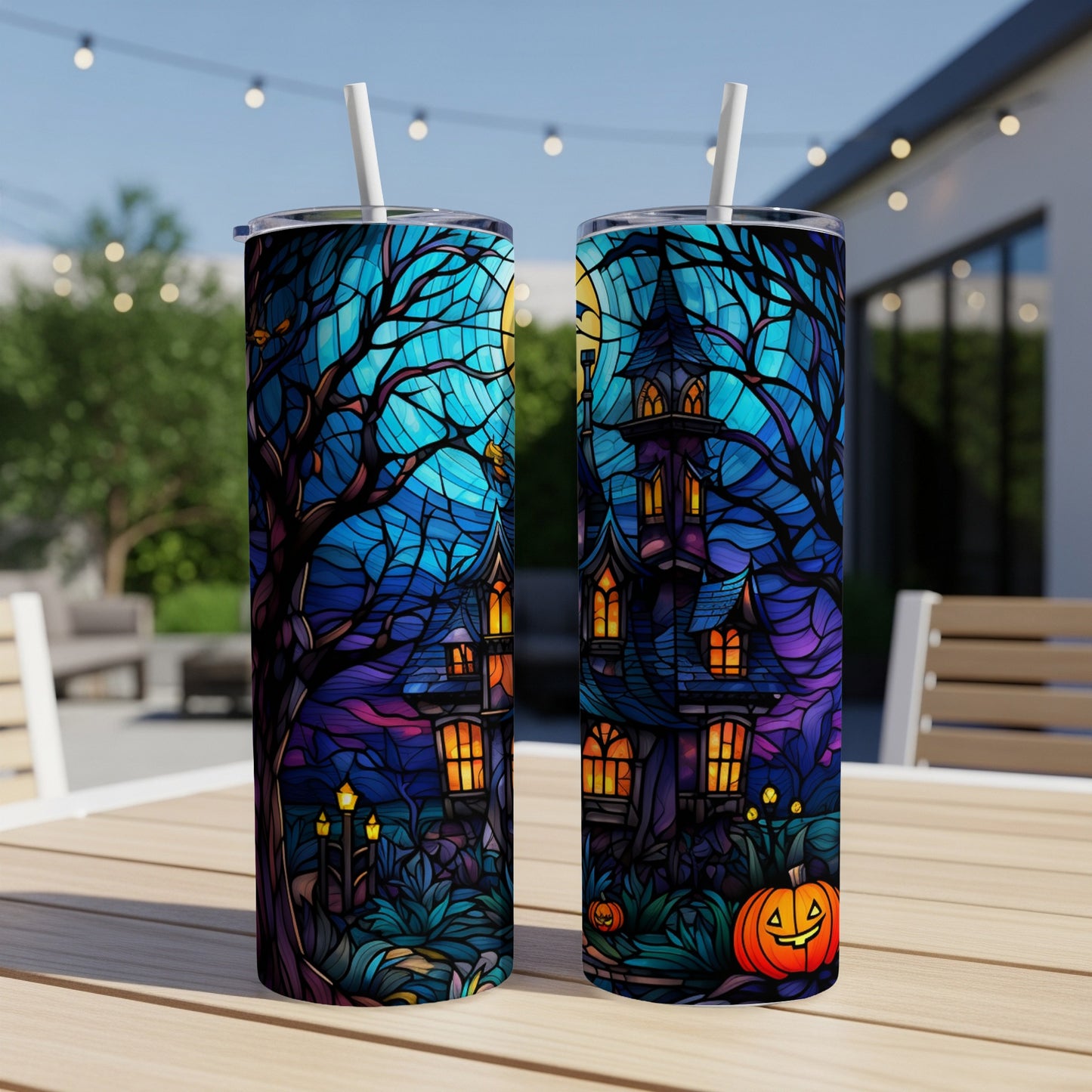 Halloween stained glass tumbler with haunted house and pumpkin design.