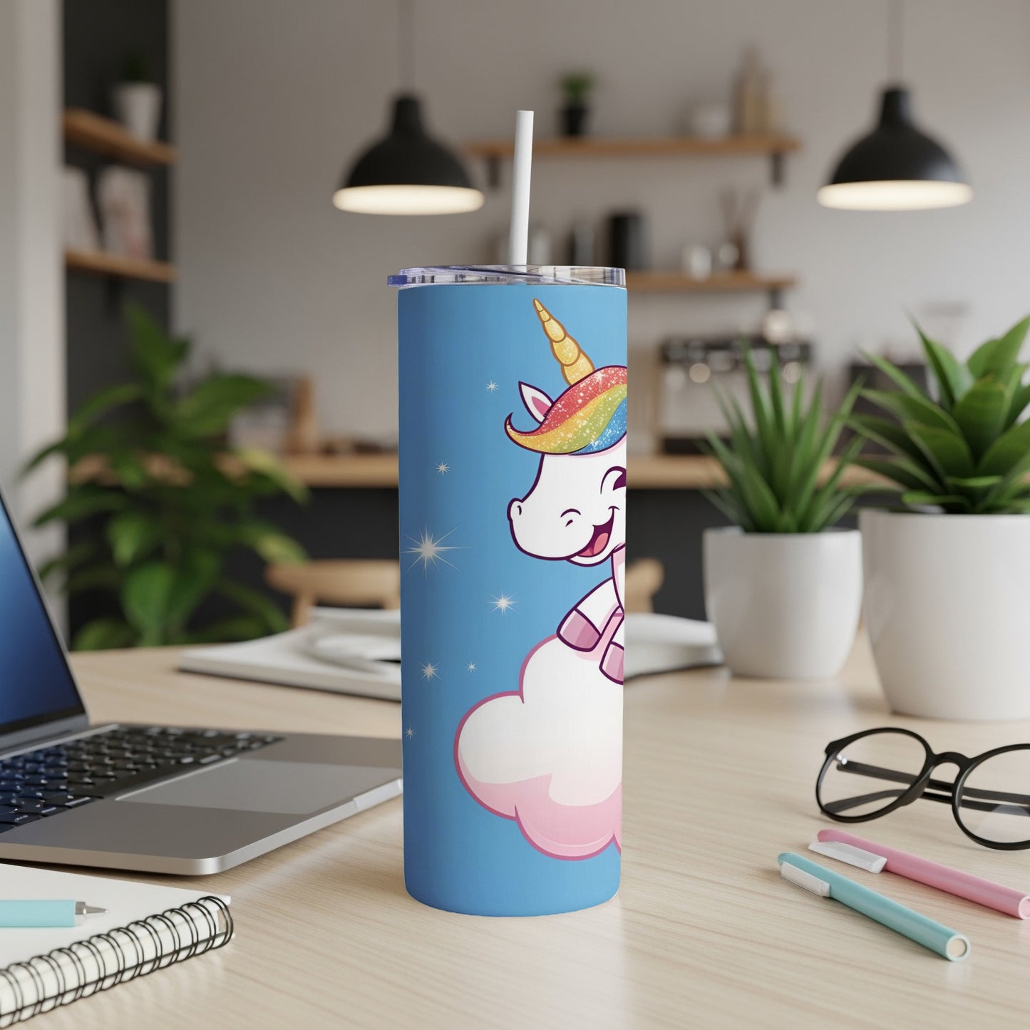 Blue tumbler with smiling unicorn on a cloud and rainbow mane.