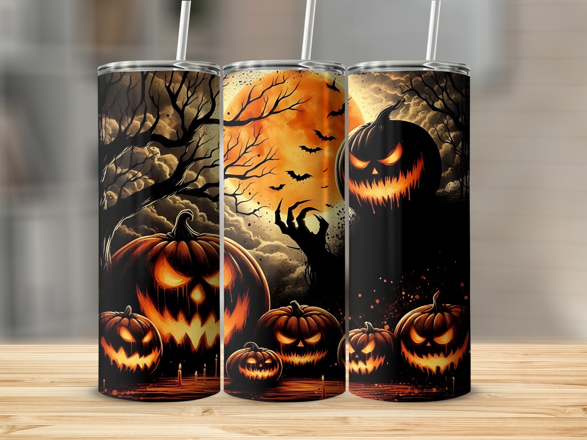 Three tumblers featuring a spooky Halloween scene with jack-o'-lanterns, bats, and a large moon.