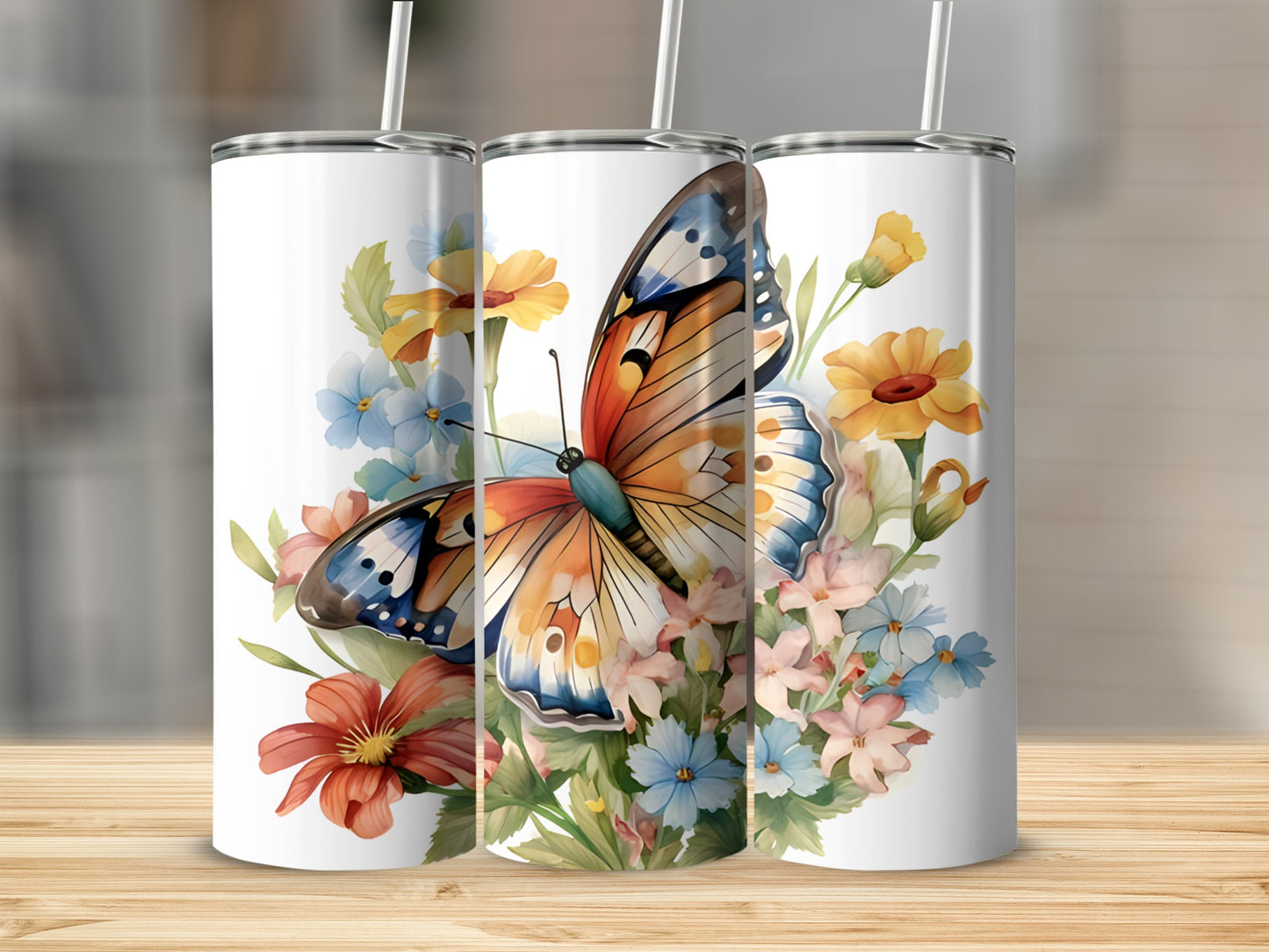 Tumbler with butterfly and floral design on white background.
