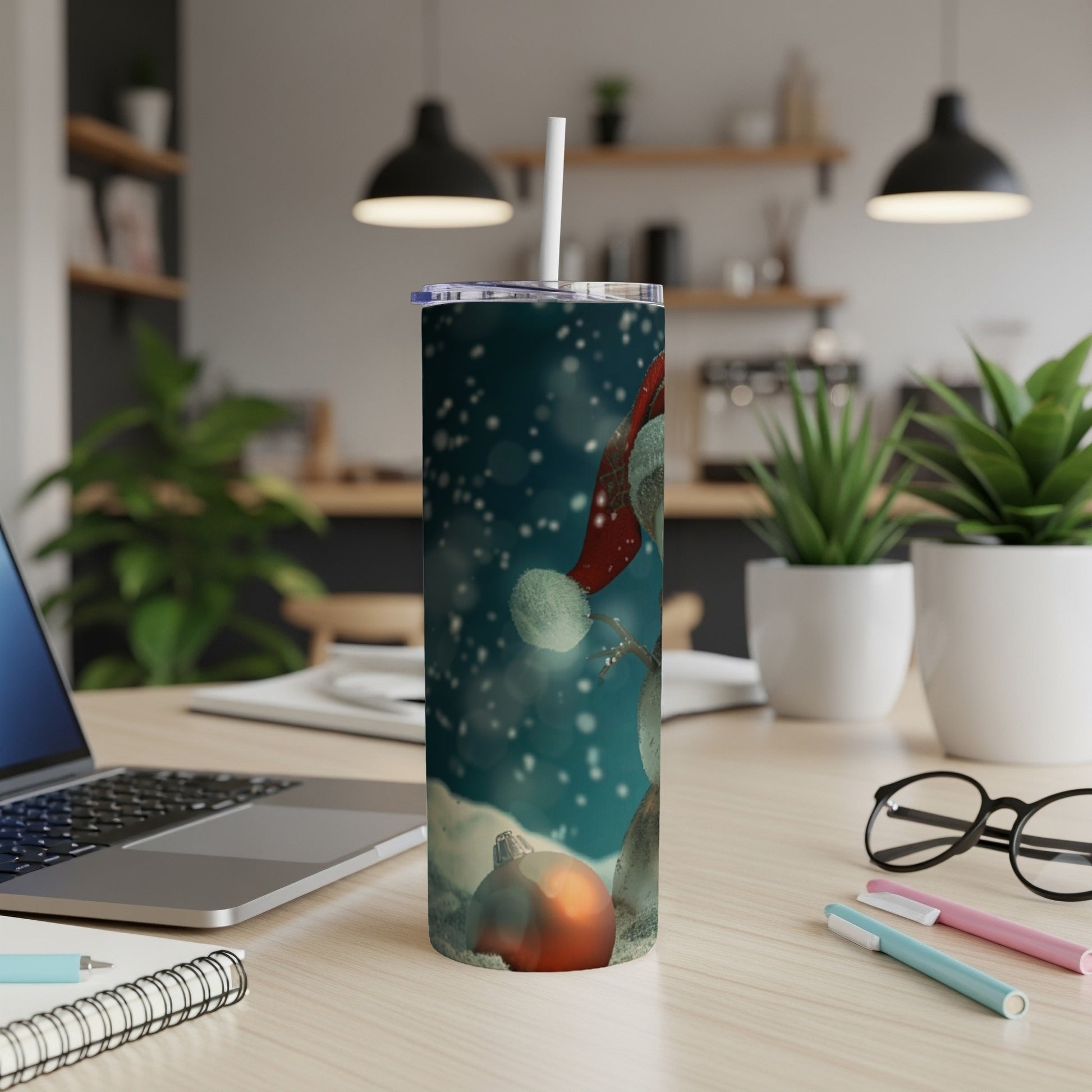 Tall, insulated tumbler with a snowman and Christmas ornament design.