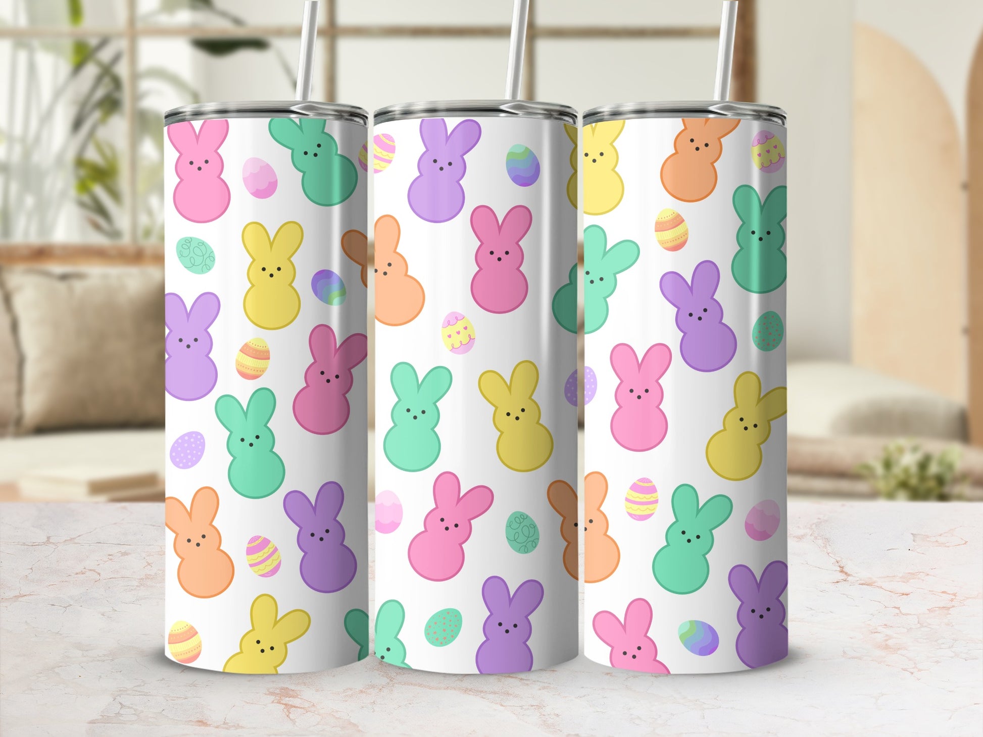 Easter bunnies and eggs pattern on three stacked tumblers.
