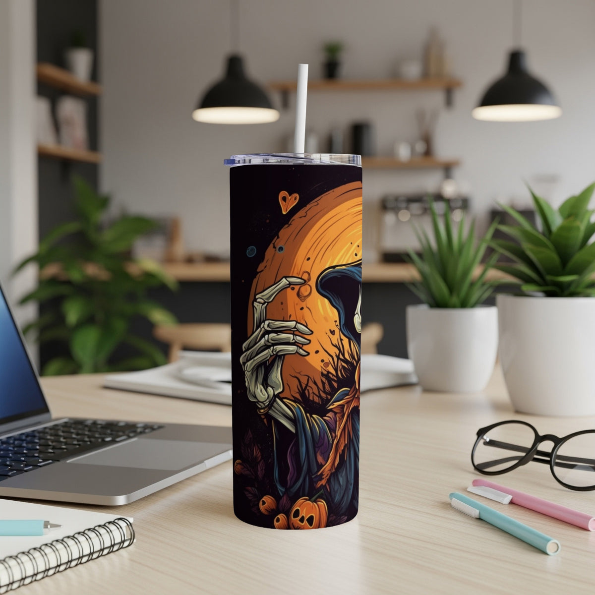 Halloween tumbler with grim reaper holding a pumpkin against an orange moon.