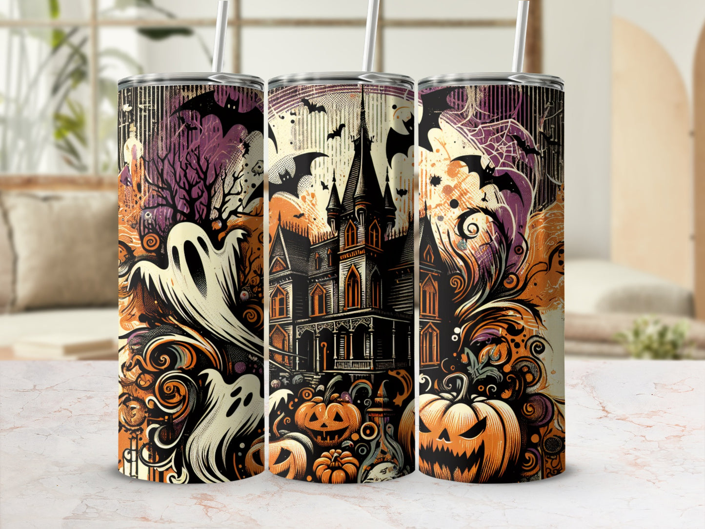 Three tumblers with Halloween designs featuring ghosts, bats, a haunted house, and pumpkins.