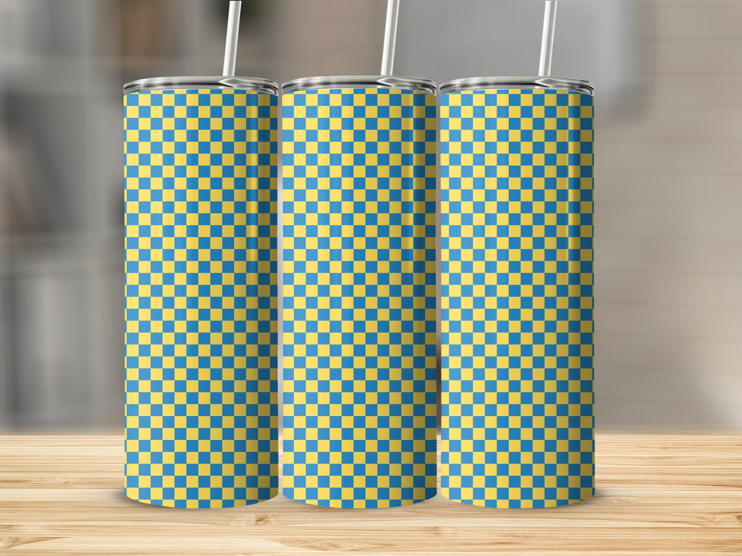 Three tall tumblers with a blue and yellow checkered pattern.