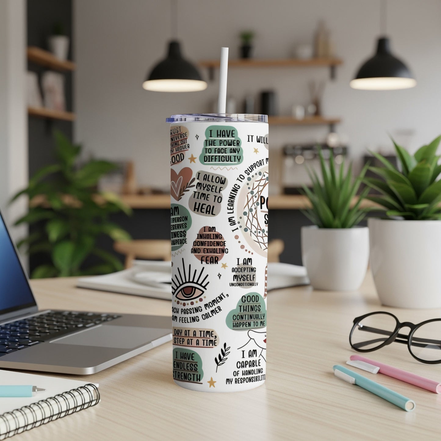 Tumbler with positive affirmations and motivational quotes in watercolor floral design.