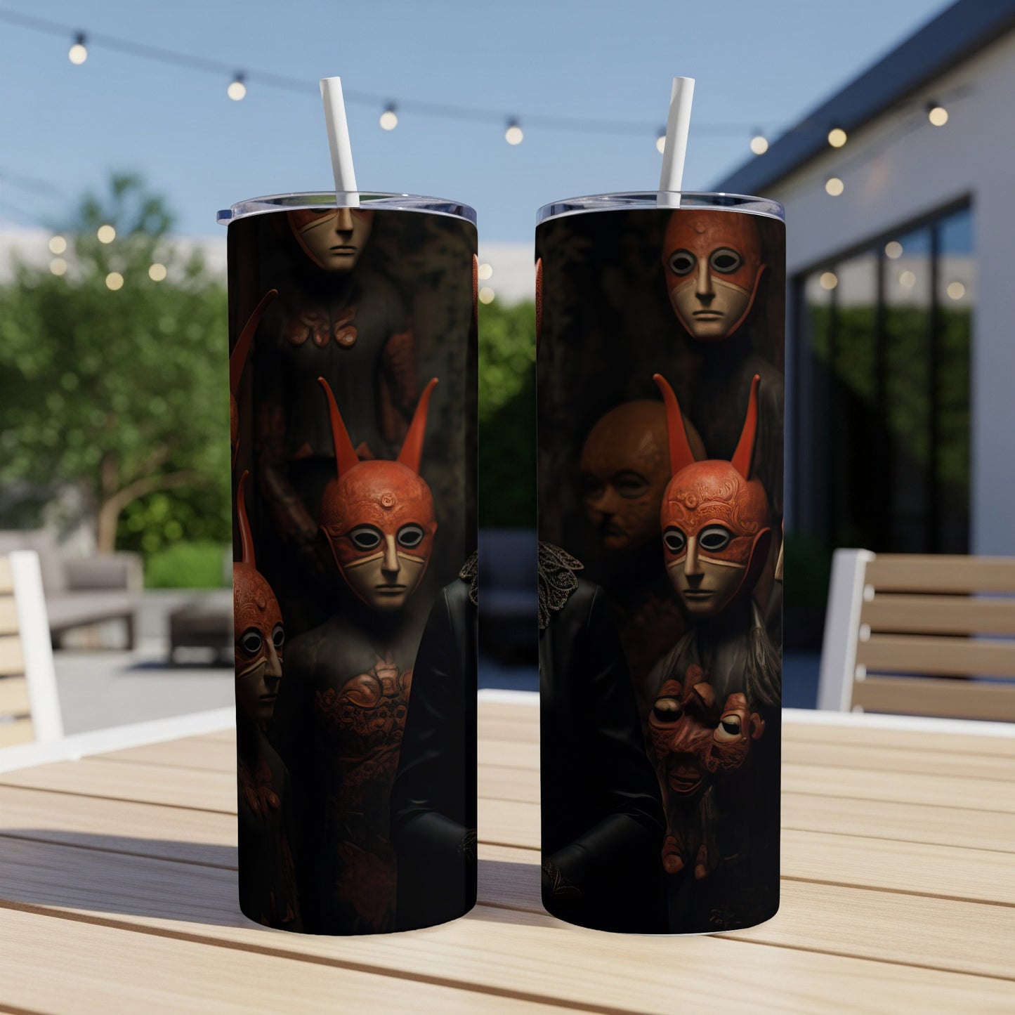 Two tumblers feature a dark, abstract design with stylized masks and figures.