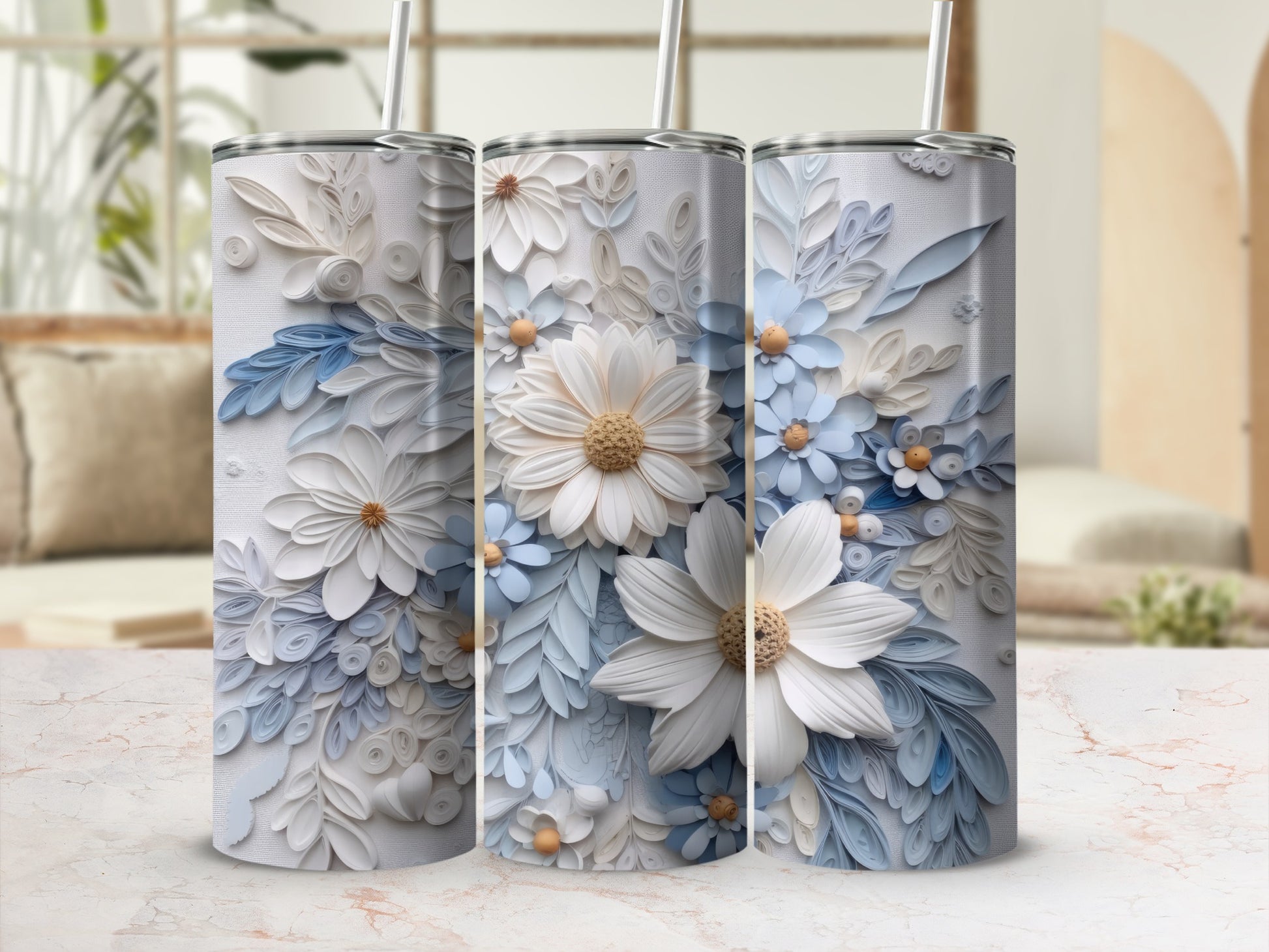 Three tumblers with delicate white and blue floral designs.