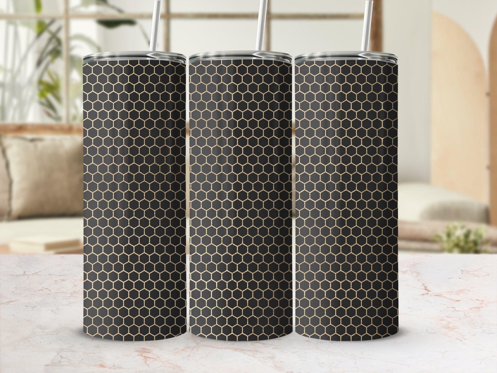 Three tall tumblers with a black and gold honeycomb pattern.