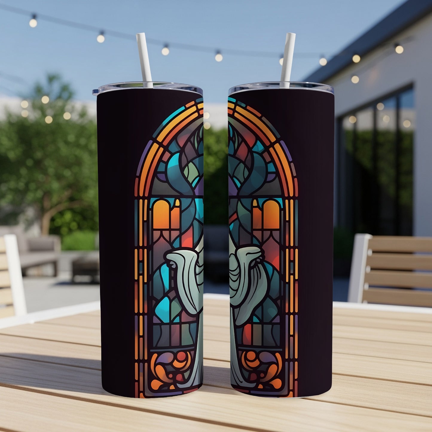 Stained glass design with dove on a dark background, on two tumblers.