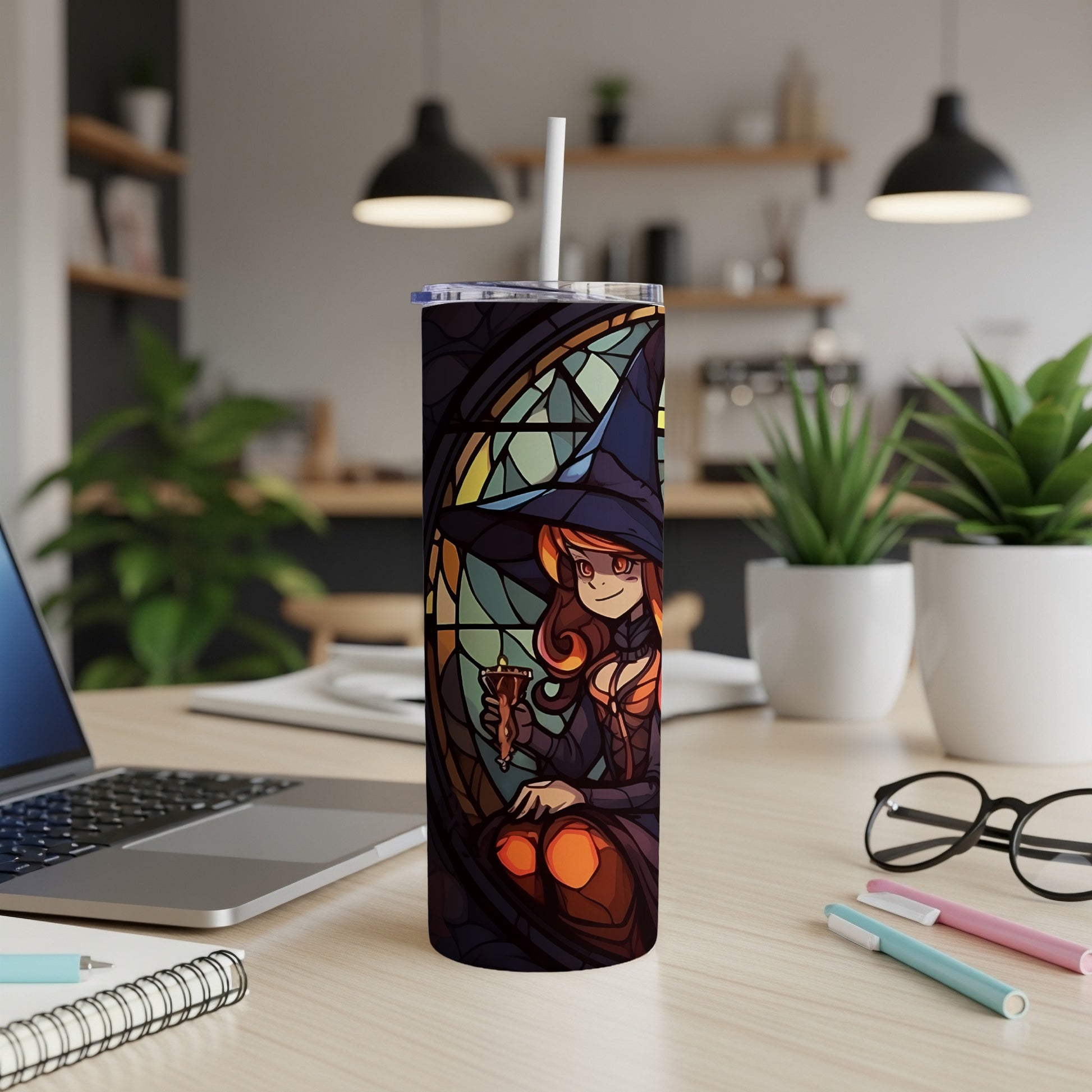 Witch in stained glass style holding a drink next to a laptop.