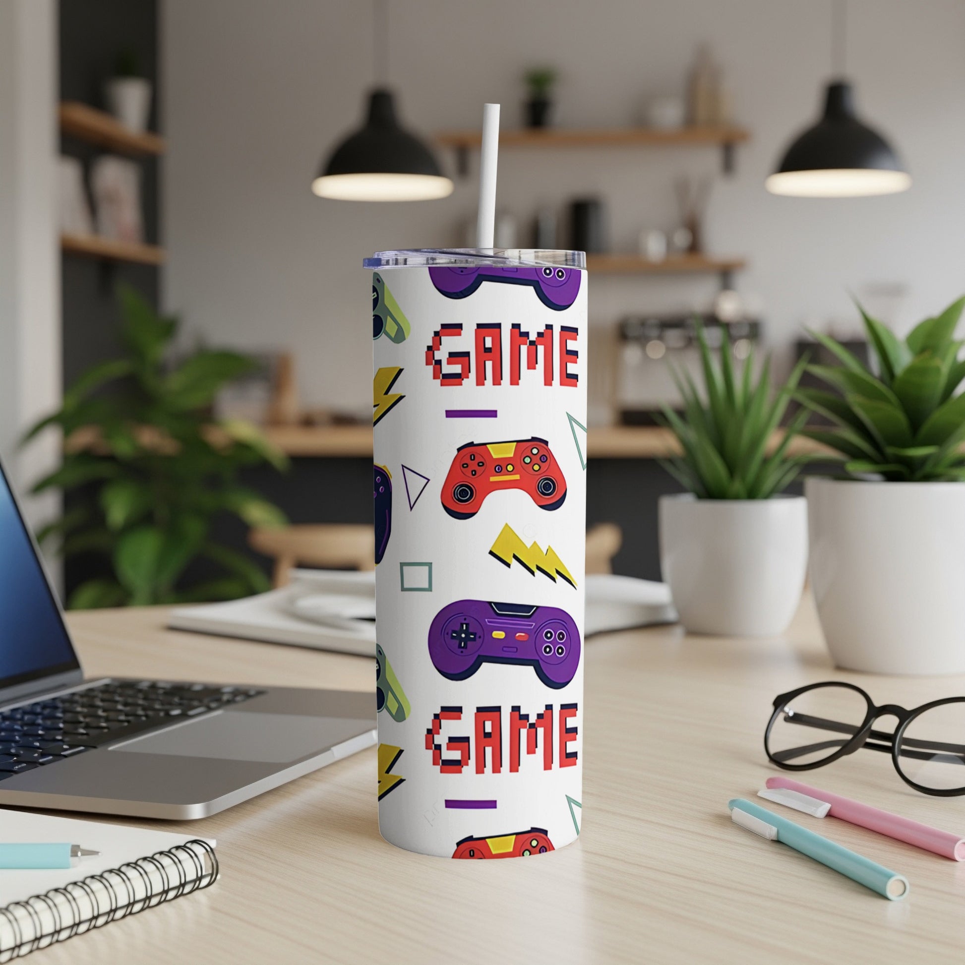 Tumbler with purple game controllers, lightning bolts, and "GAME" text.