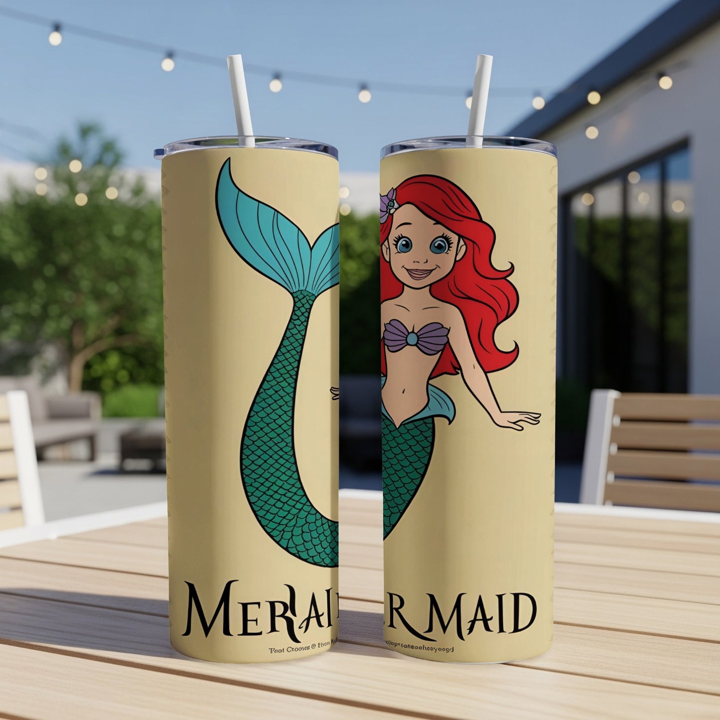 Mermaid character with red hair and green tail on a beige tumbler.