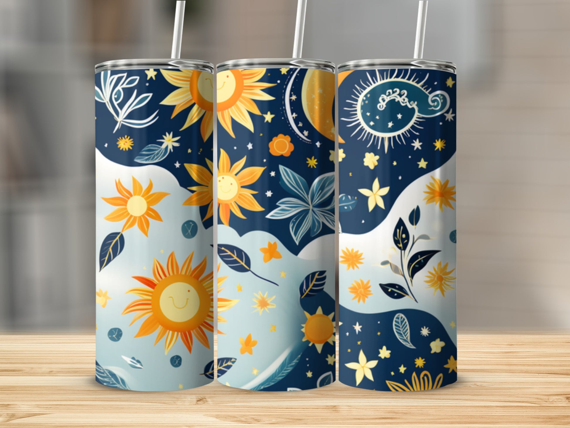 Three tall tumblers with celestial and sun designs in blue, yellow, and white.
