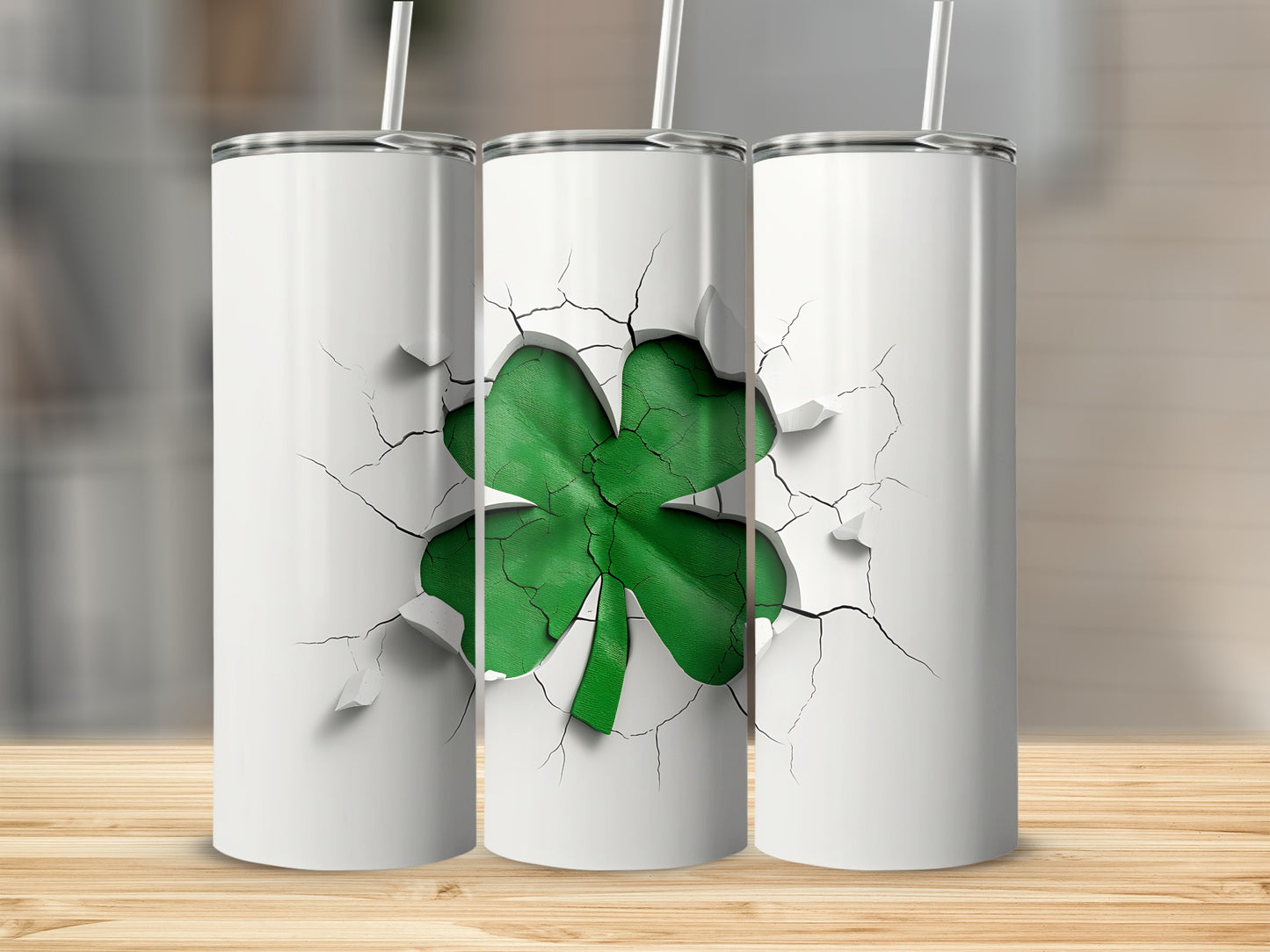 Three white tumblers with cracked surface revealing a green shamrock design.