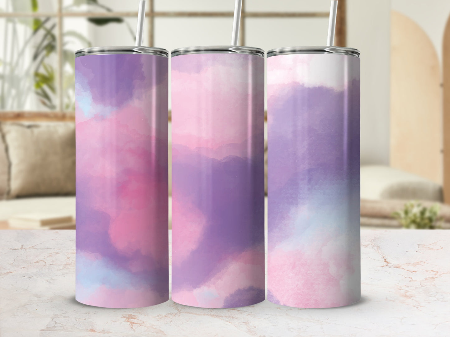 Three tumblers with abstract watercolor patterns in pink, purple, and blue.