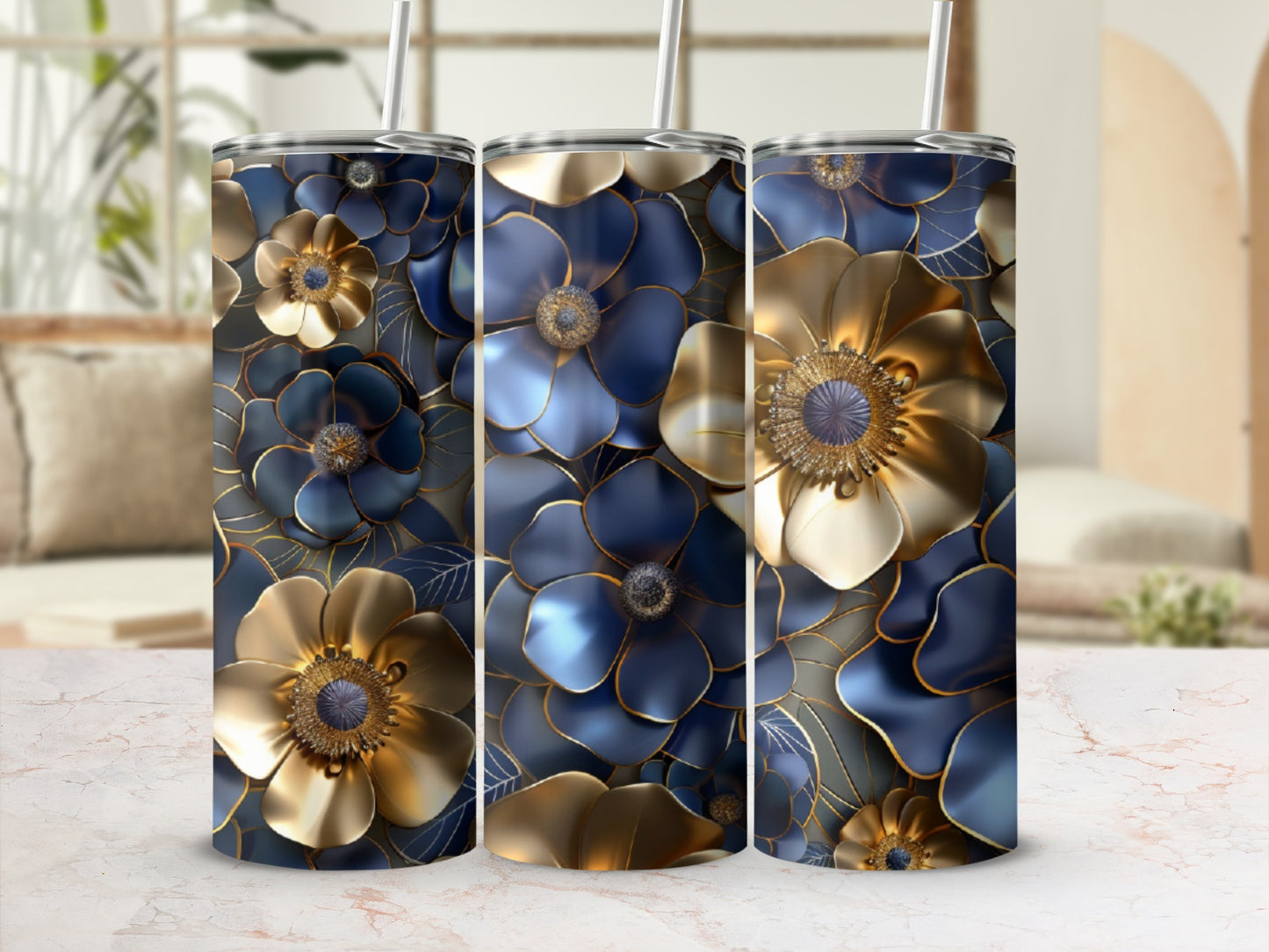 Three tumblers with gold and blue floral designs.