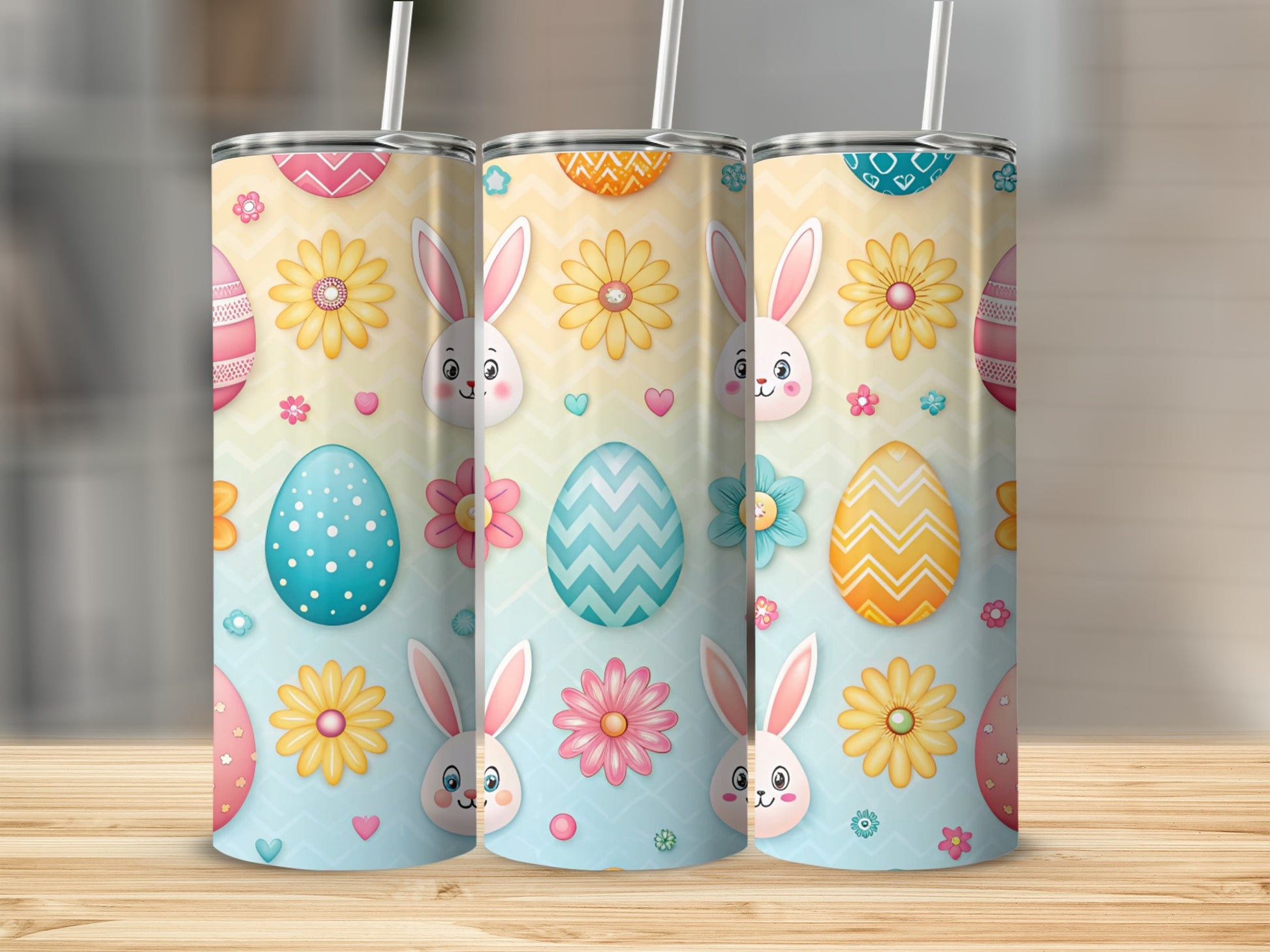 Three Easter-themed tumblers with bunnies, eggs, and flowers.