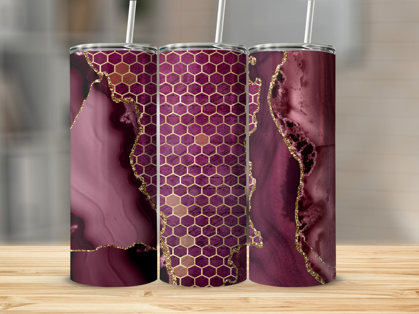 Three tumblers with burgundy marble and gold honeycomb patterns.