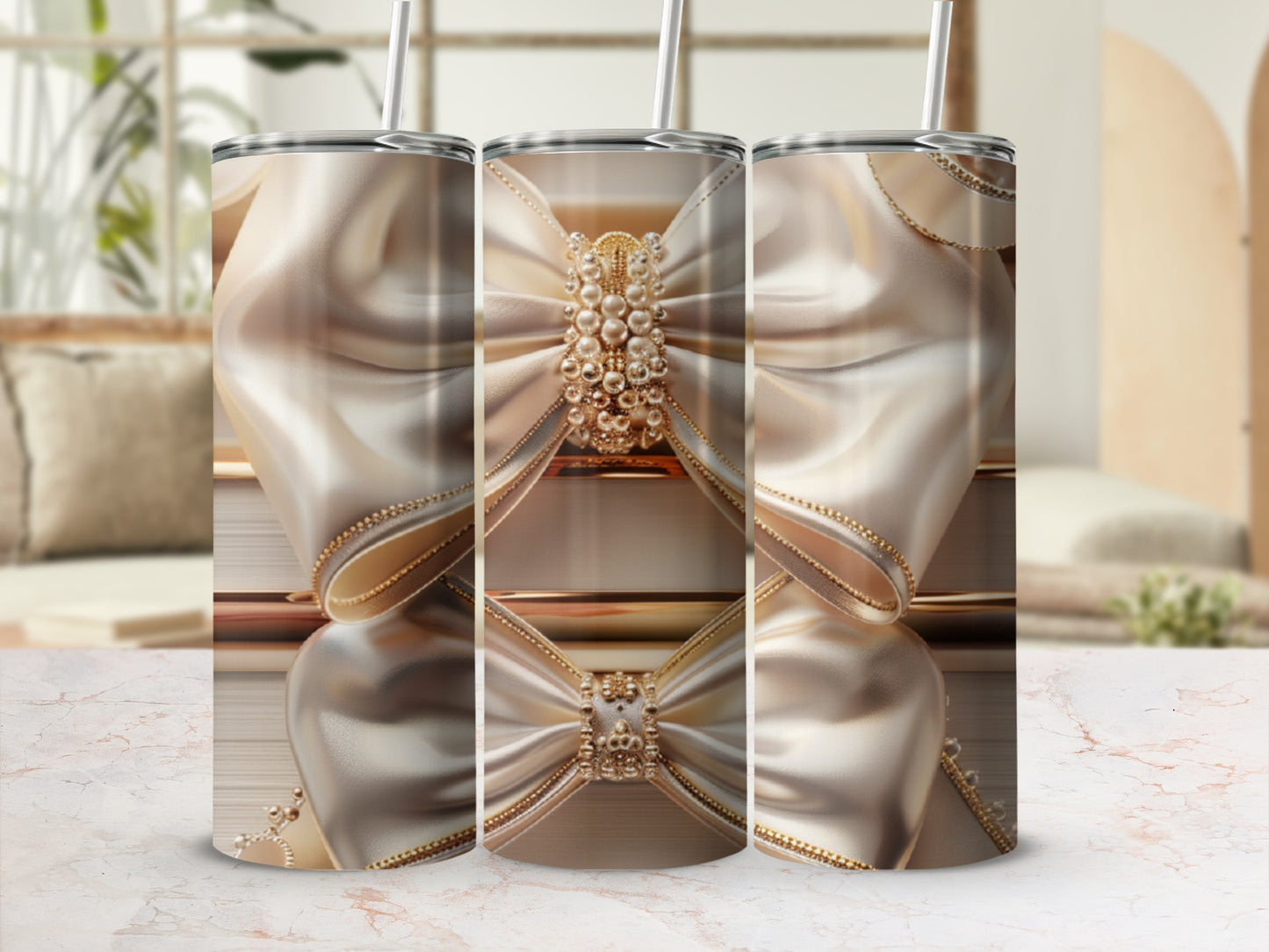 Three elegant tumblers with pearl and gold bow embellishments.