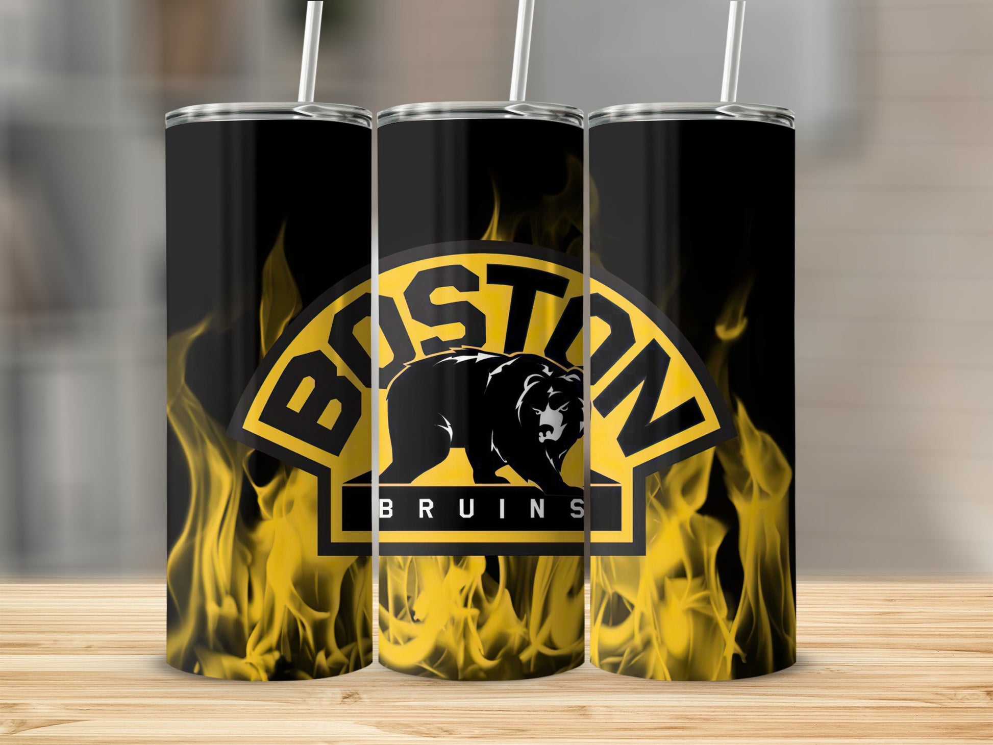 Boston Bruins logo with flames on black tumblers with white straws.